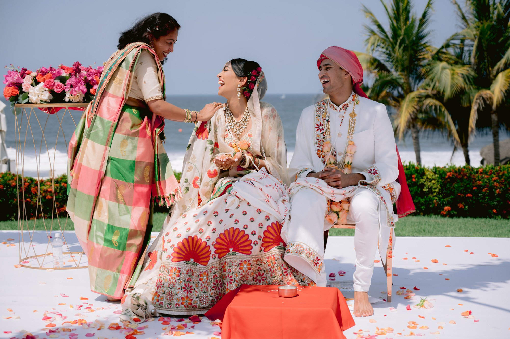 a man and woman sitting on a beach