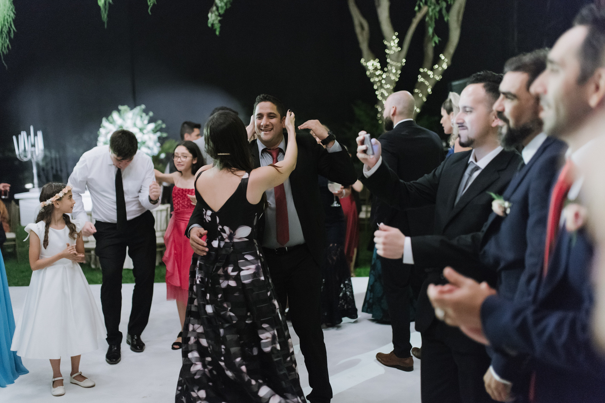 a group of people dancing on a dance floor