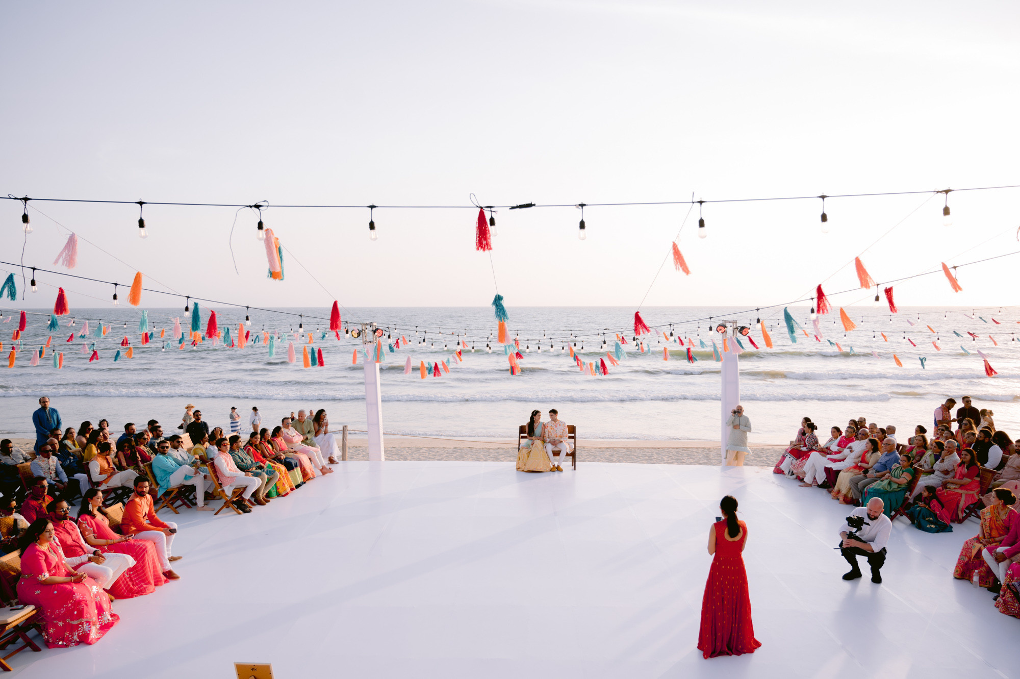 a group of people sitting on a beach