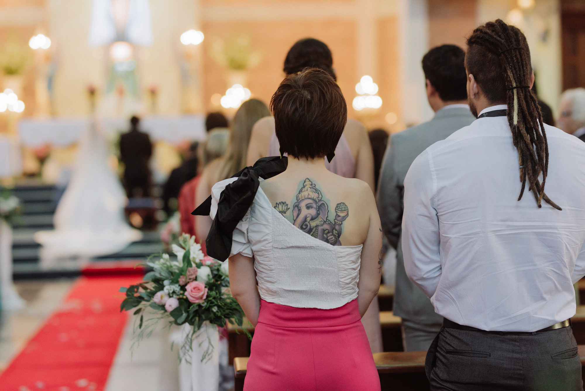 a couple is sitting in a church together