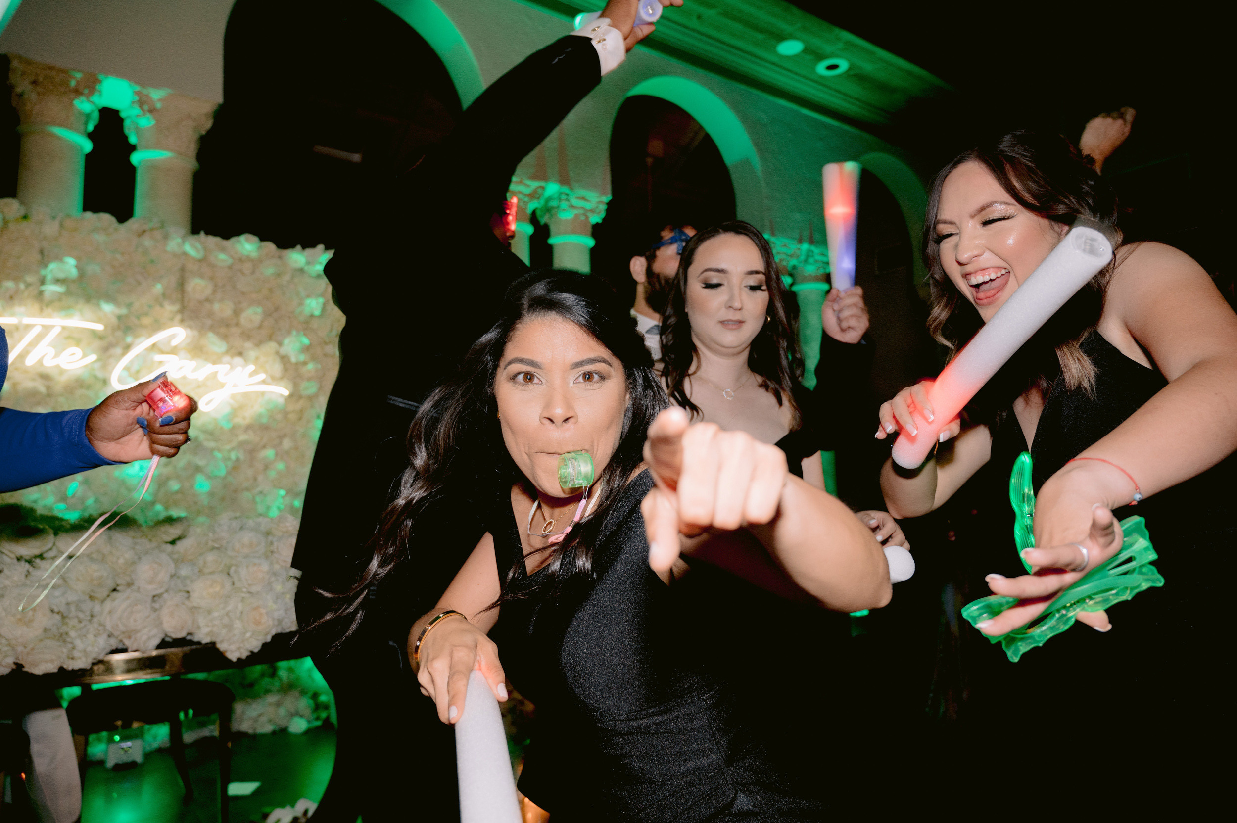 a group of people standing around a table