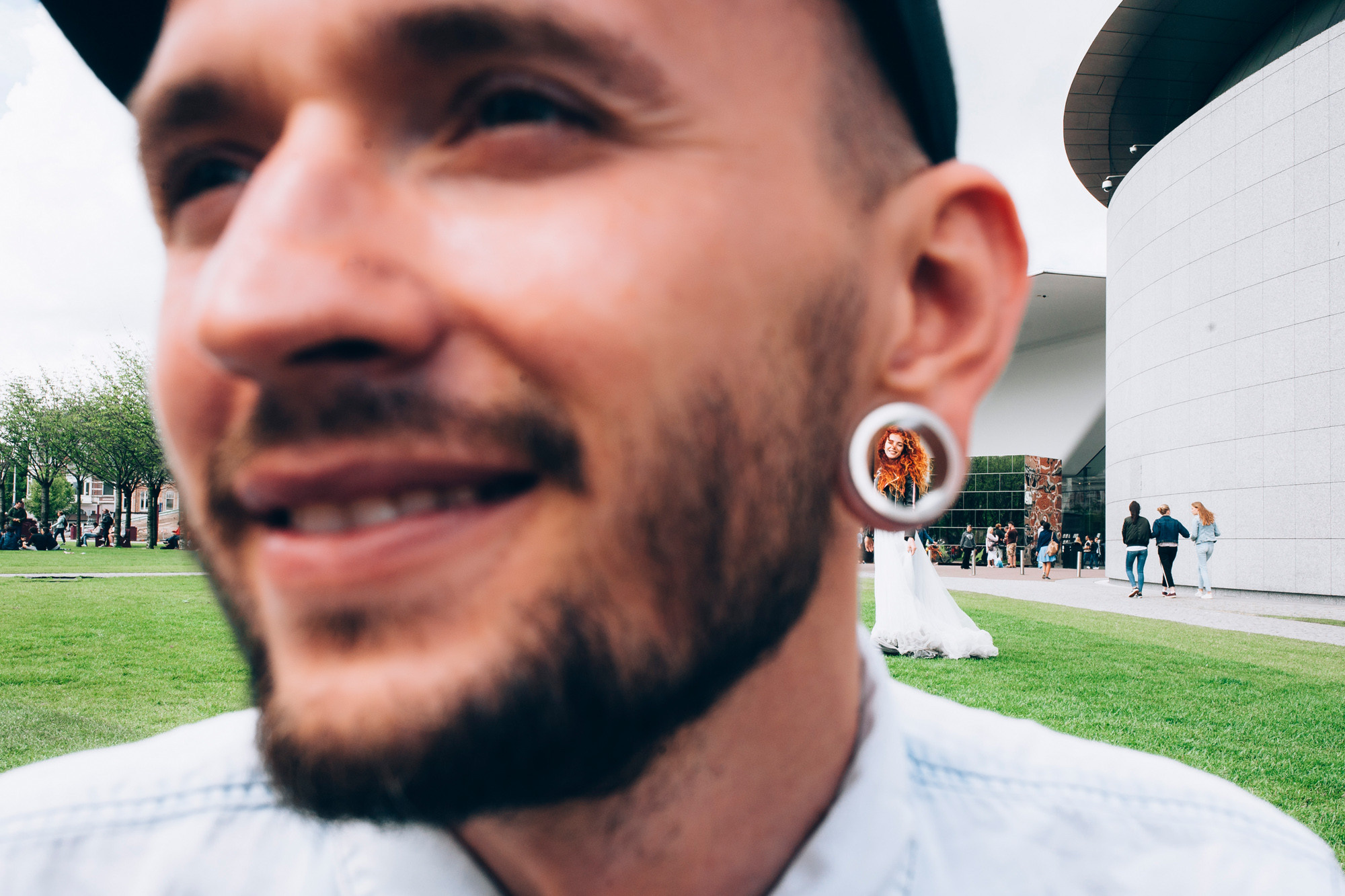 a man with a hat and a tie around his neck