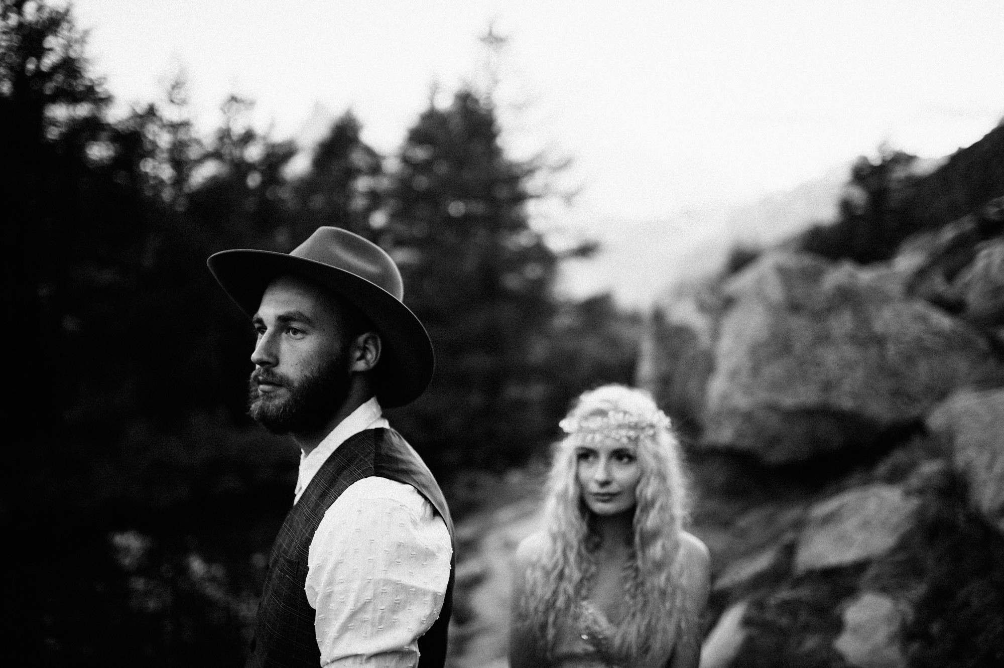 a man and woman standing next to each other people