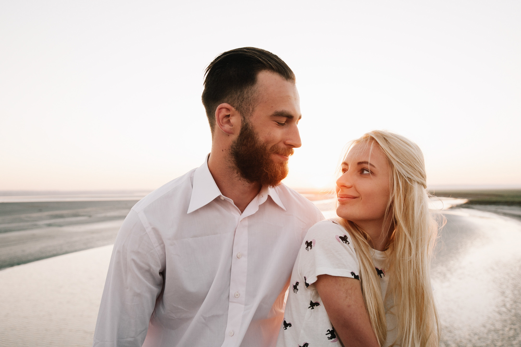 a man and woman standing next to each other