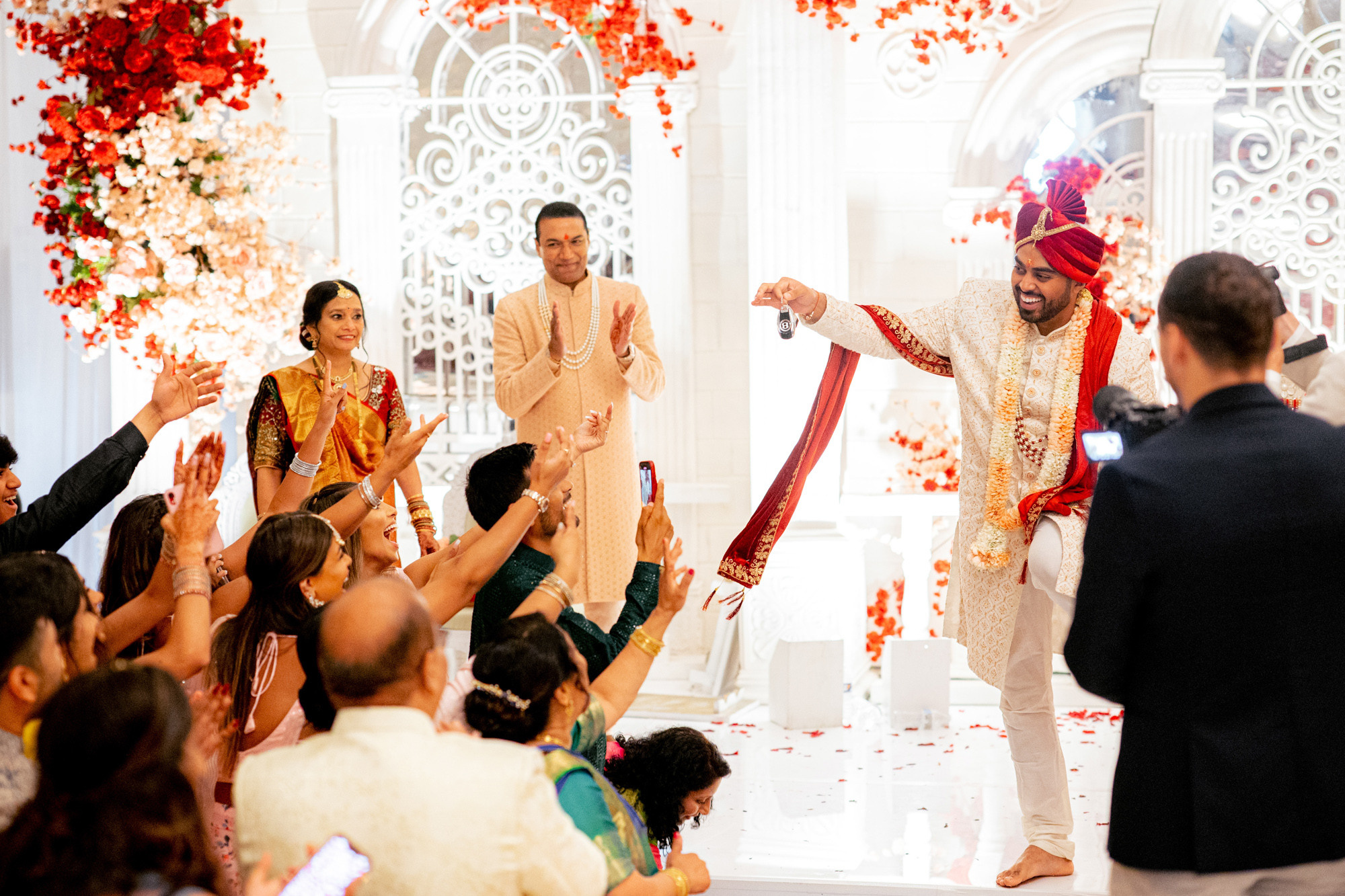 a man and woman are walking down the aisle