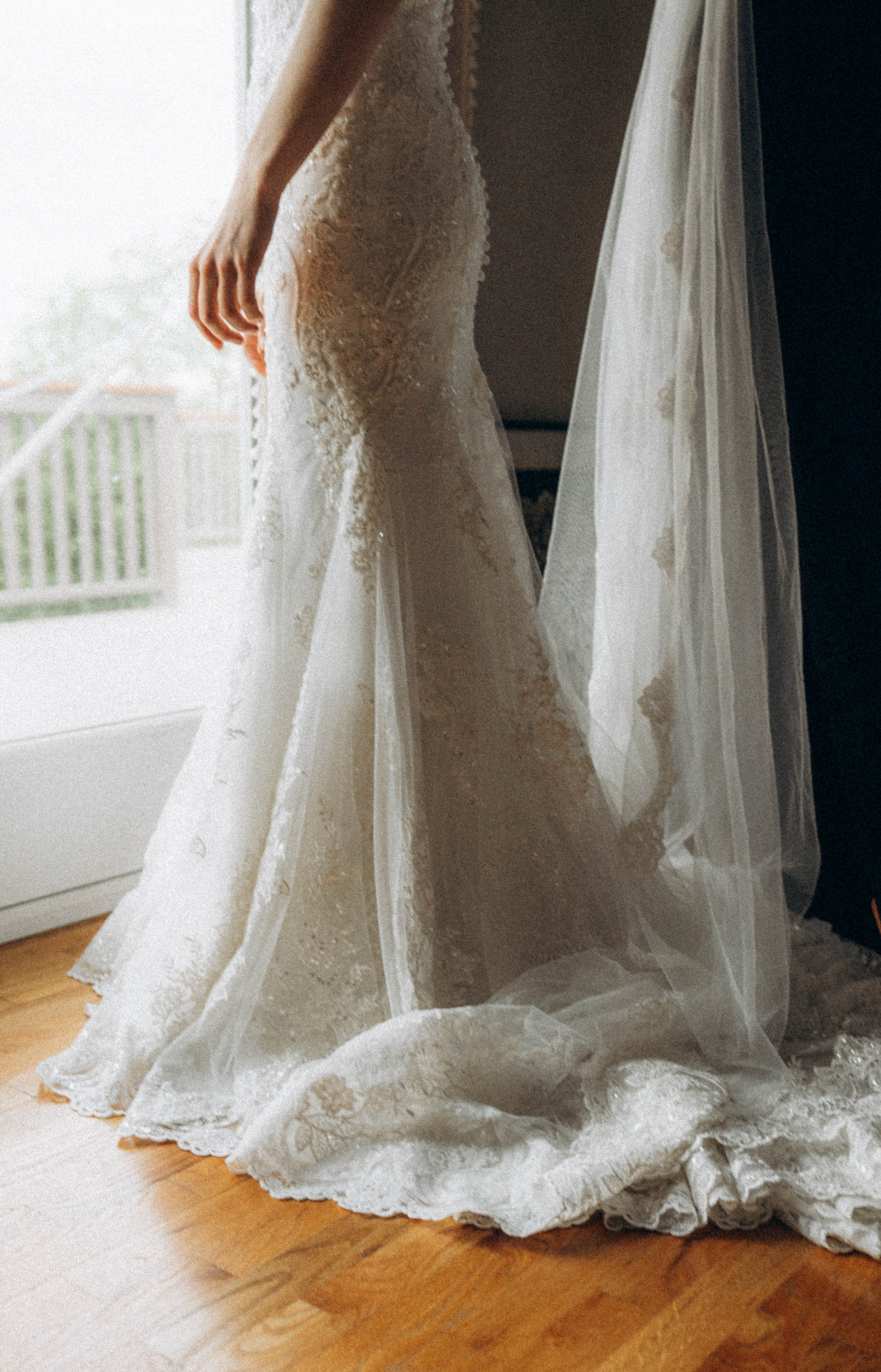 Bride smiling with Sacandaga Lake mountains behind.