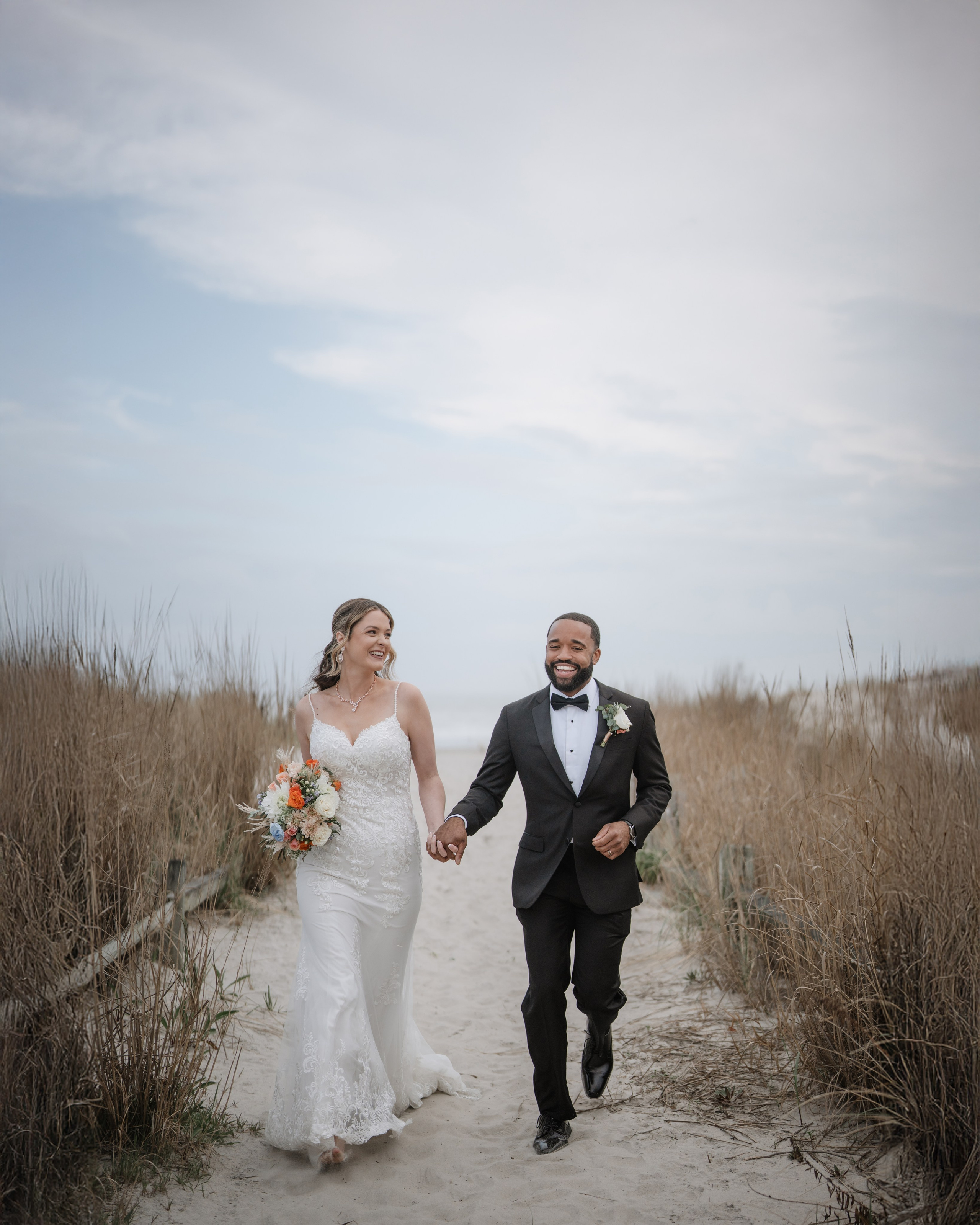 Wedding walk on the beach. Portrait and wedding photographer in New York