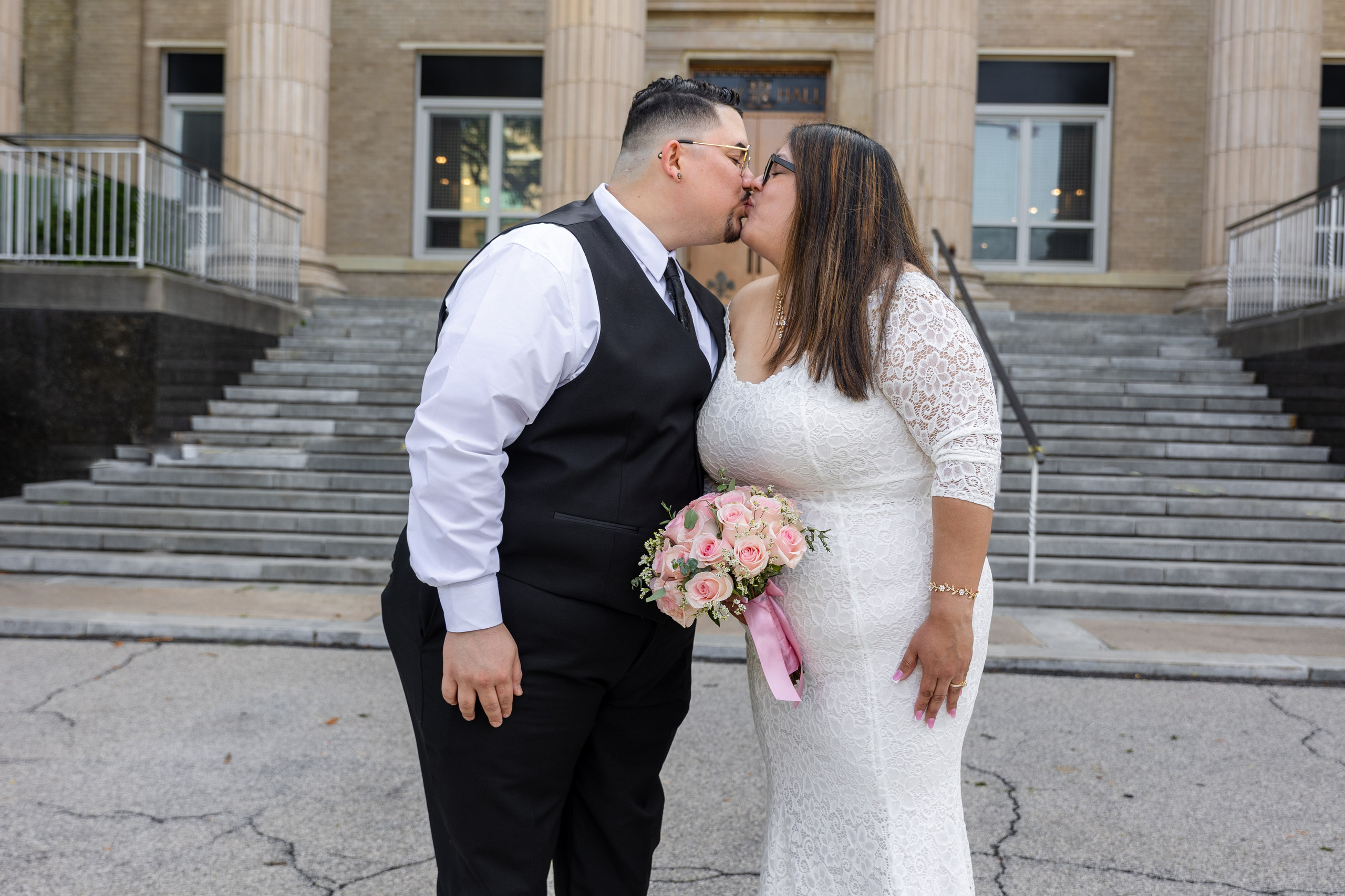 Bride holding a pink bouquet during her intimate New Rochelle City Hall wedding