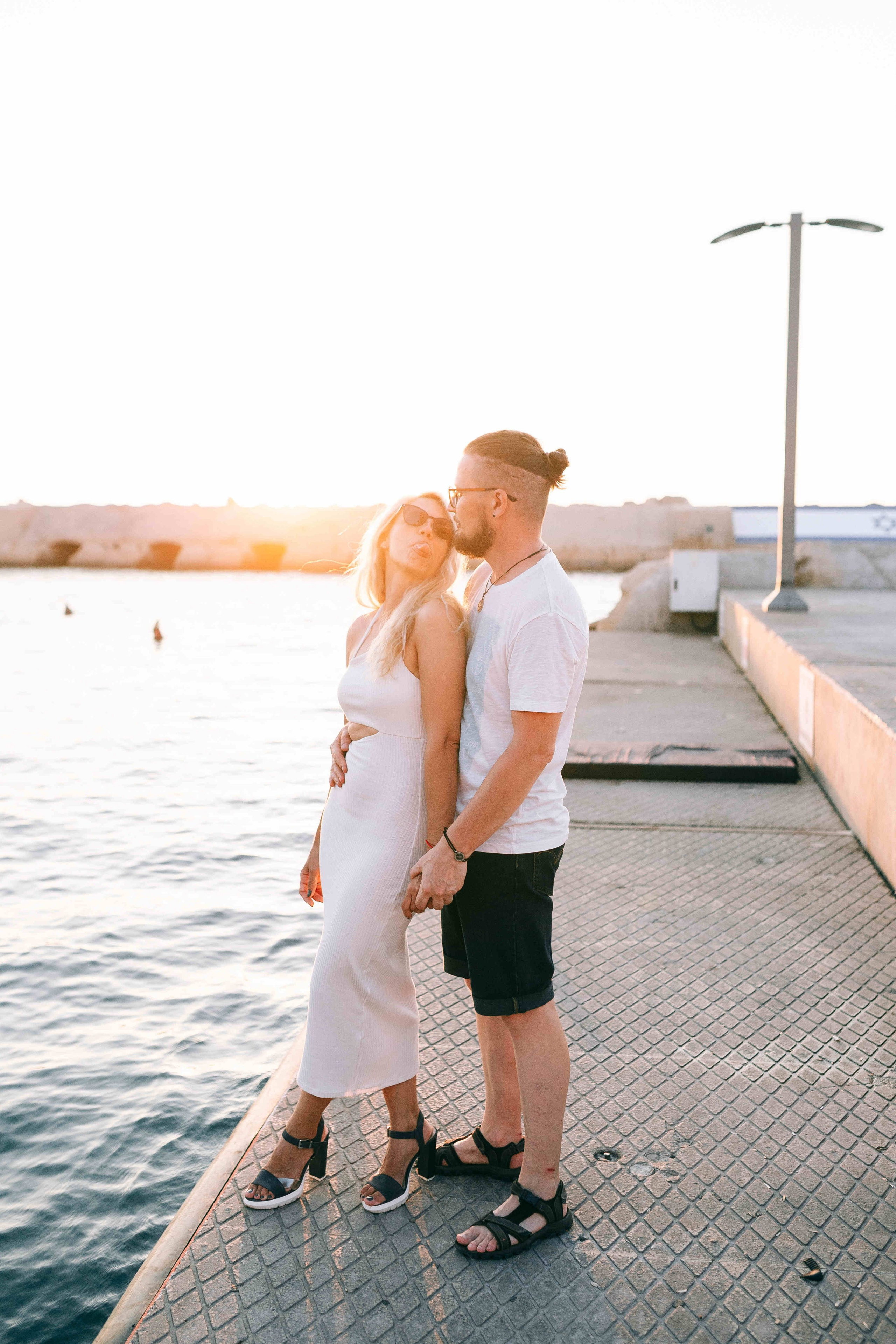 SUNSET IN JAFFO PORT. PHOTOGRAPHER IN ISRAEL