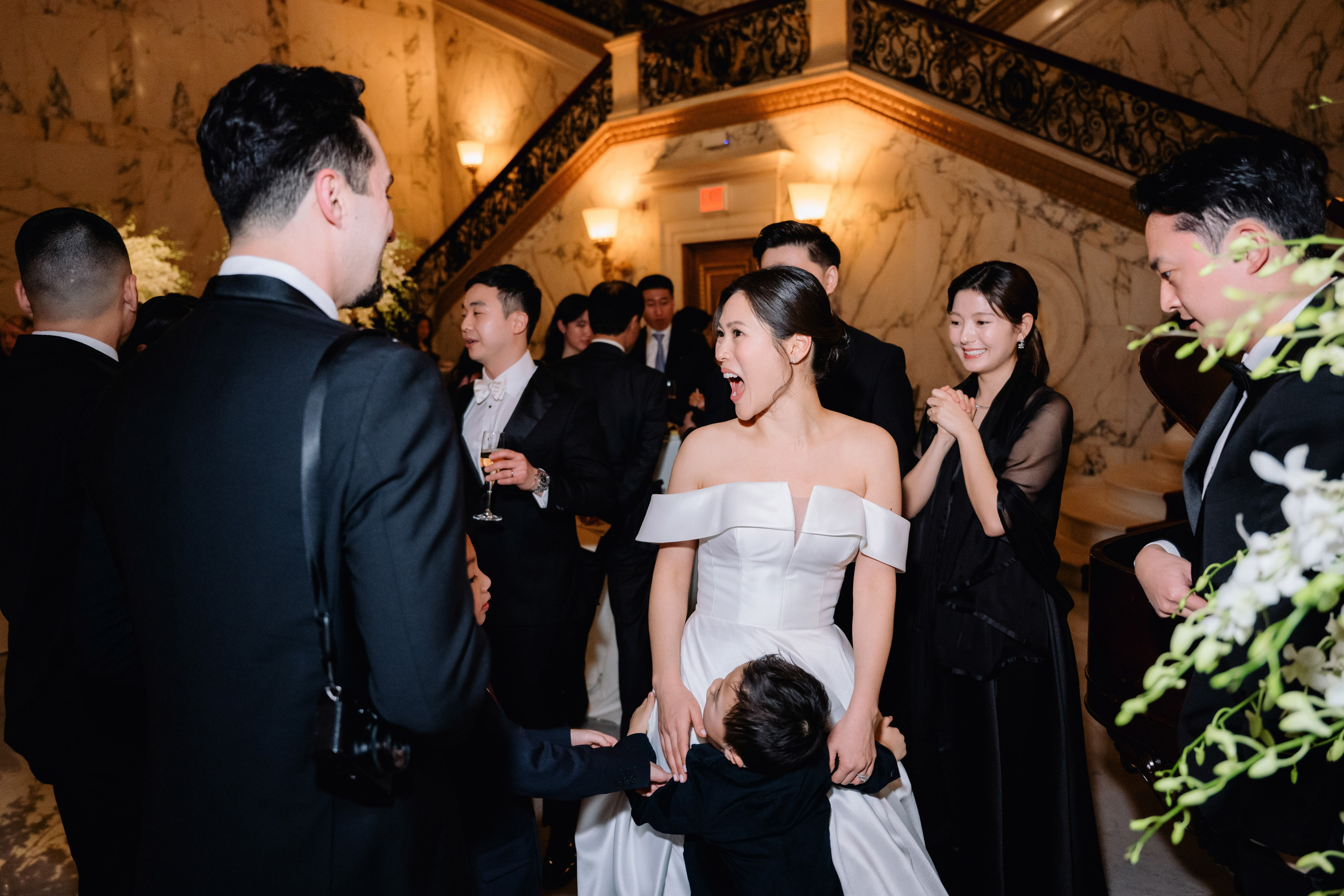 a bride and groom are standing in a room