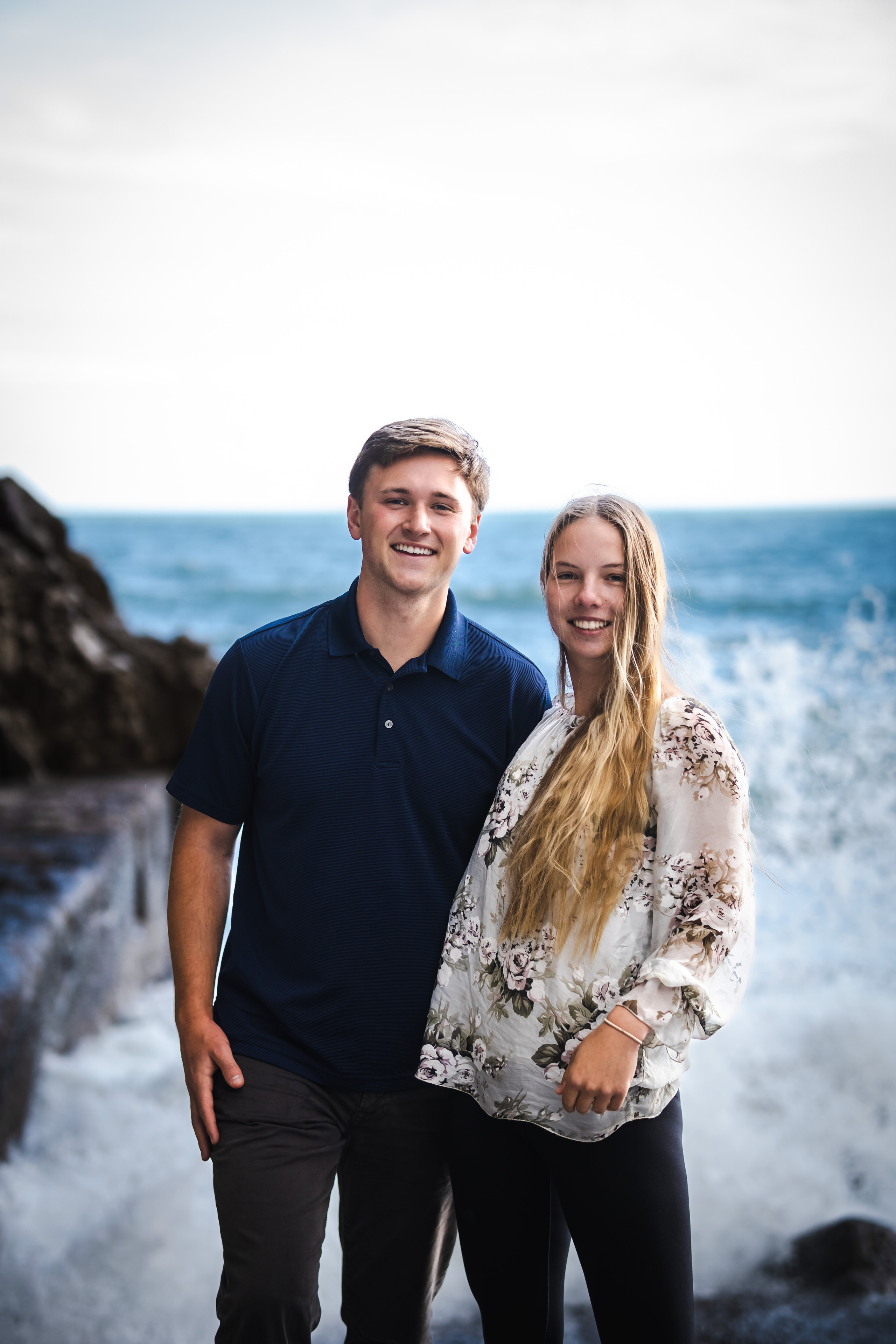 Childhood sweethearts standing in Amalfi beach