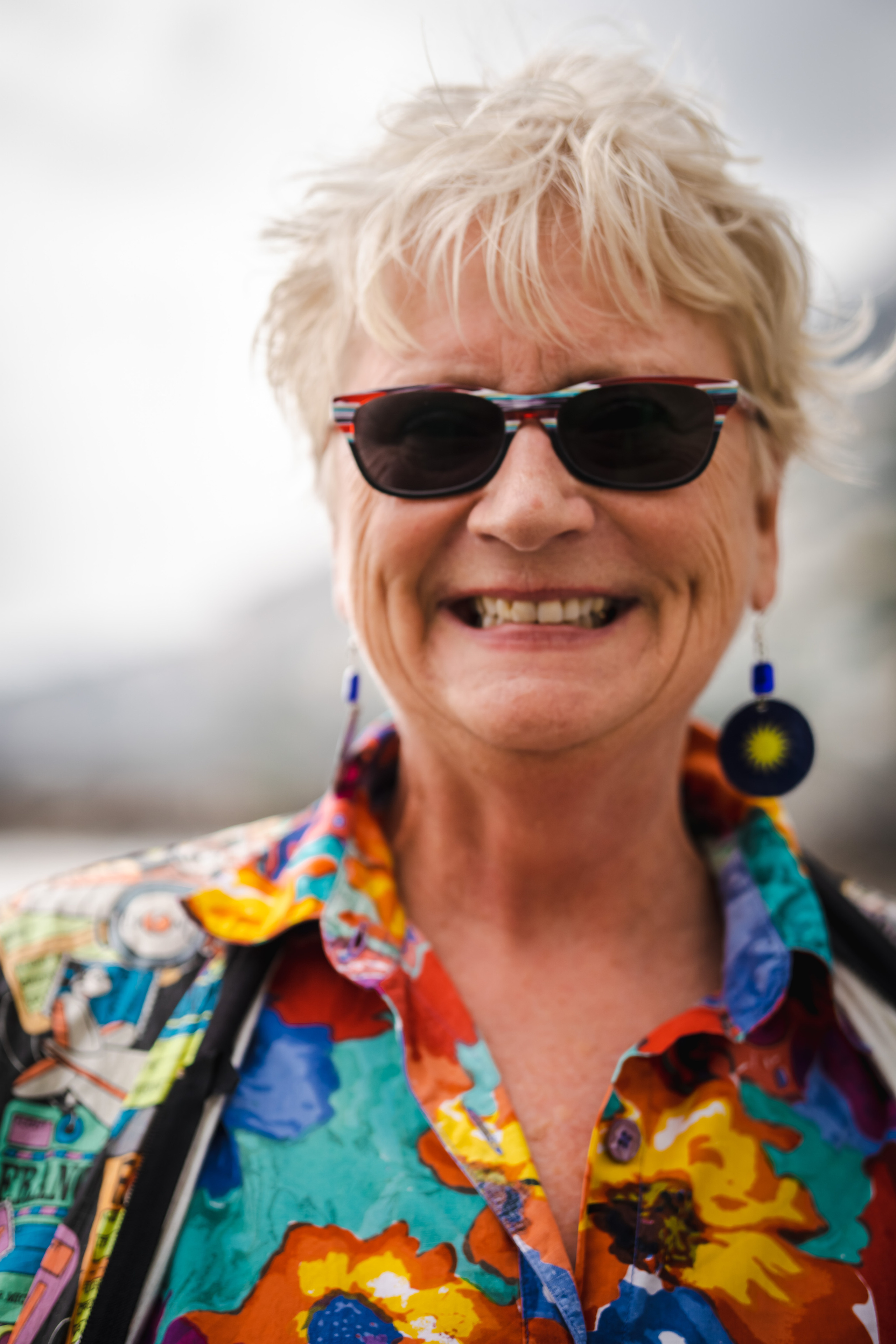 Close-up happy portrait of American lady in Amalfi beach