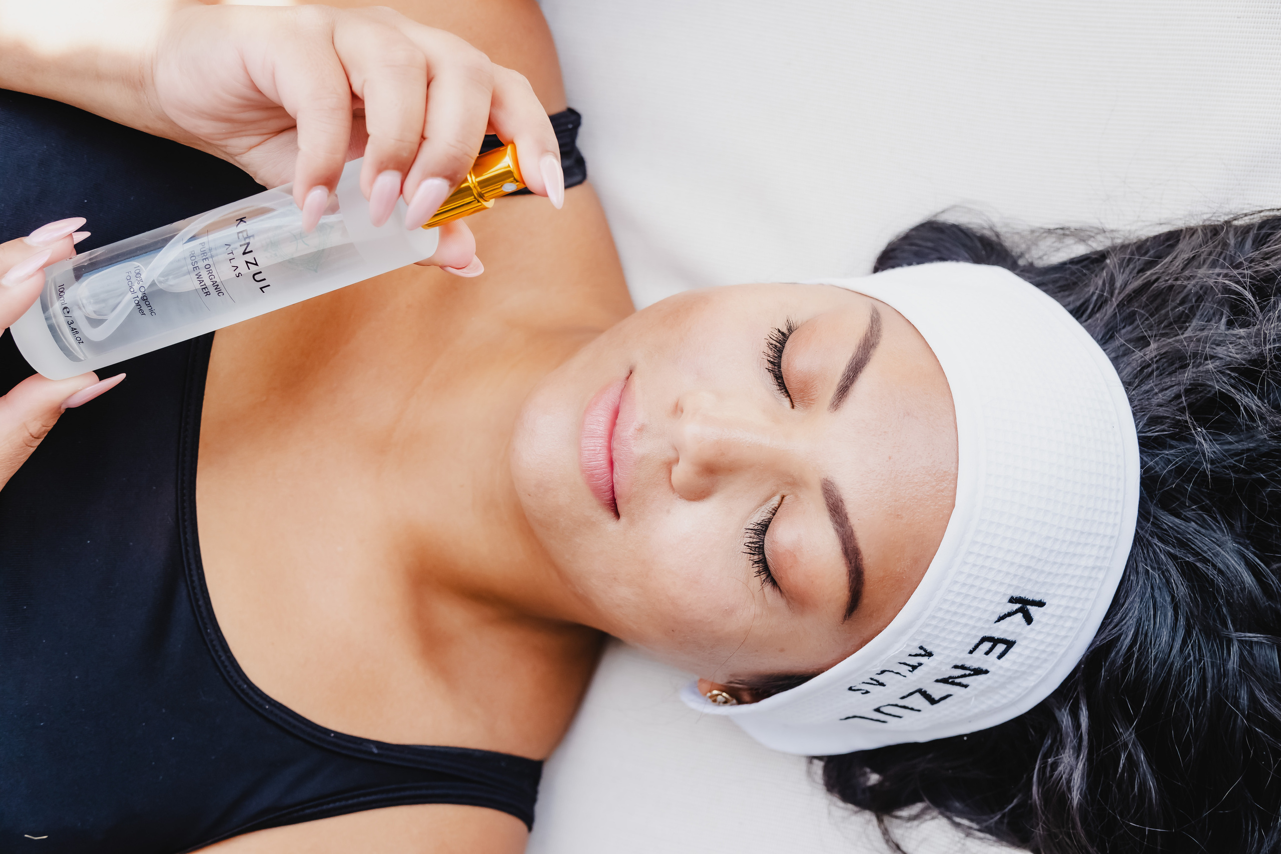 girl holding a white transparent bottle
