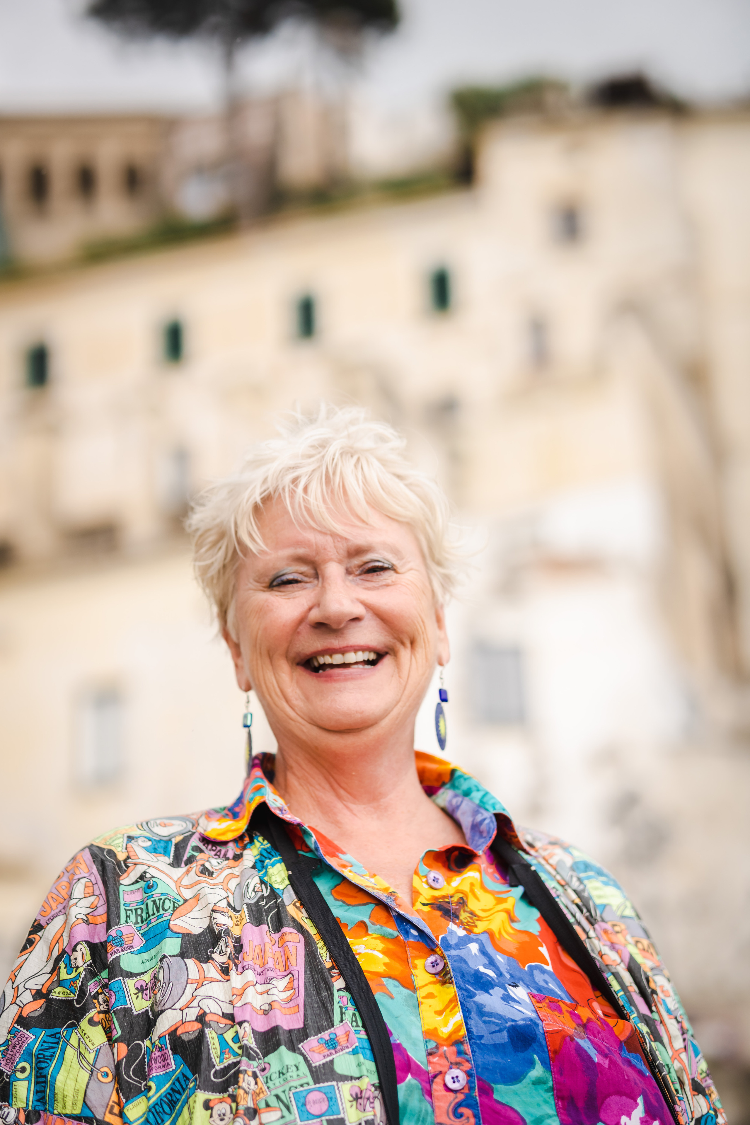 Close-up happy portrait of American lady in Amalfi beach
