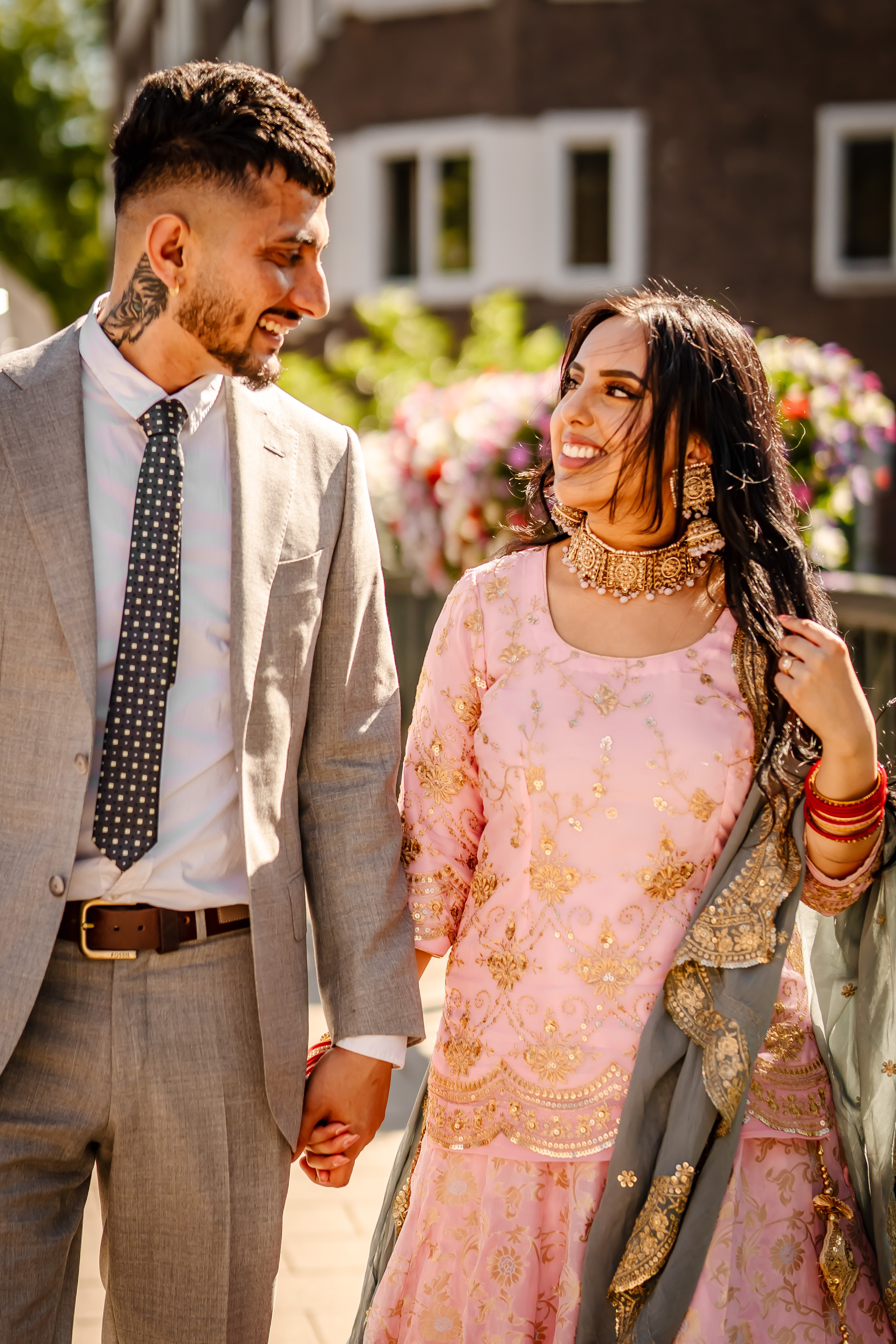 a bridal couple walking on streets of amsterdam