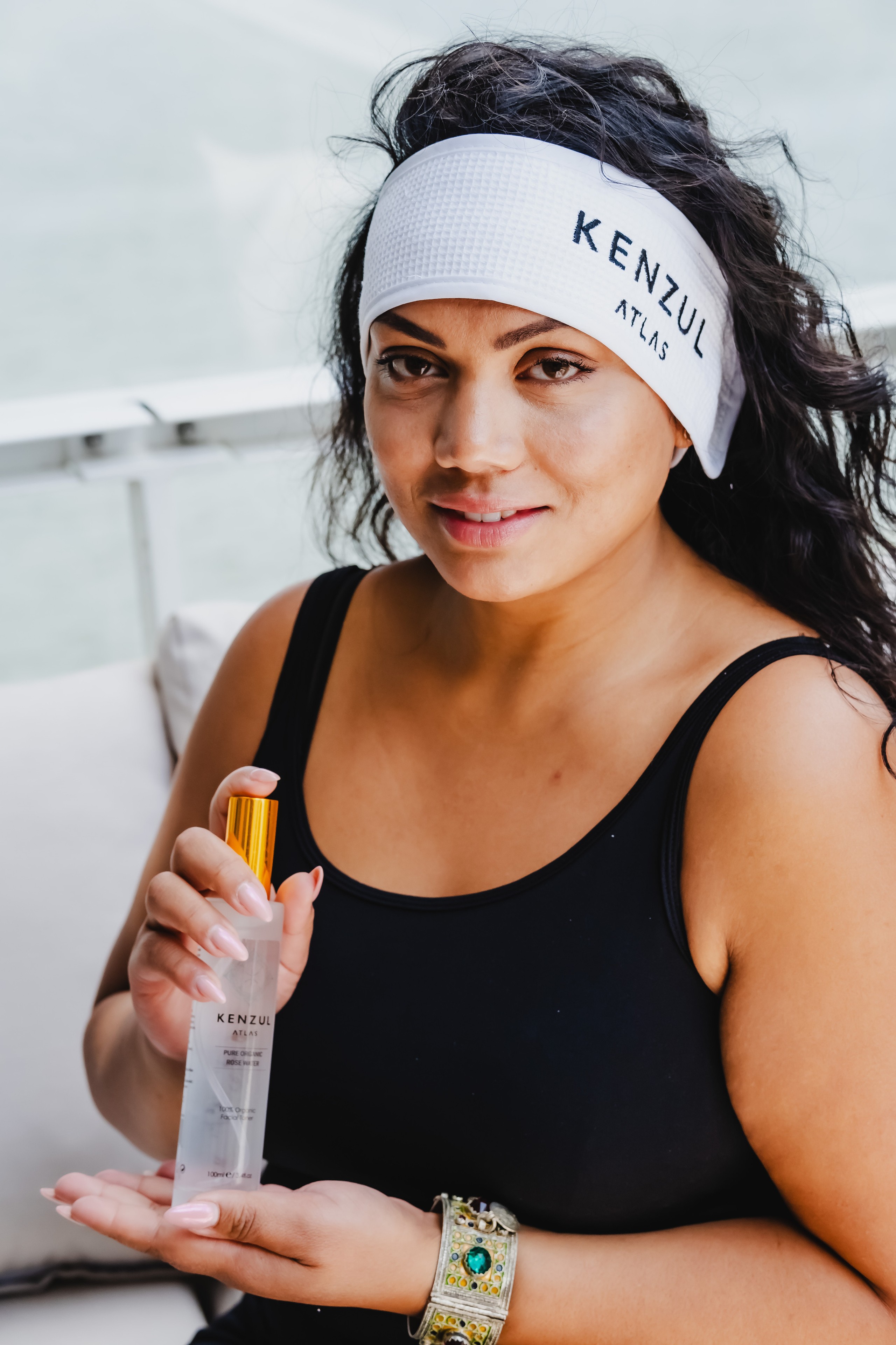 girl holding a white transparent bottle