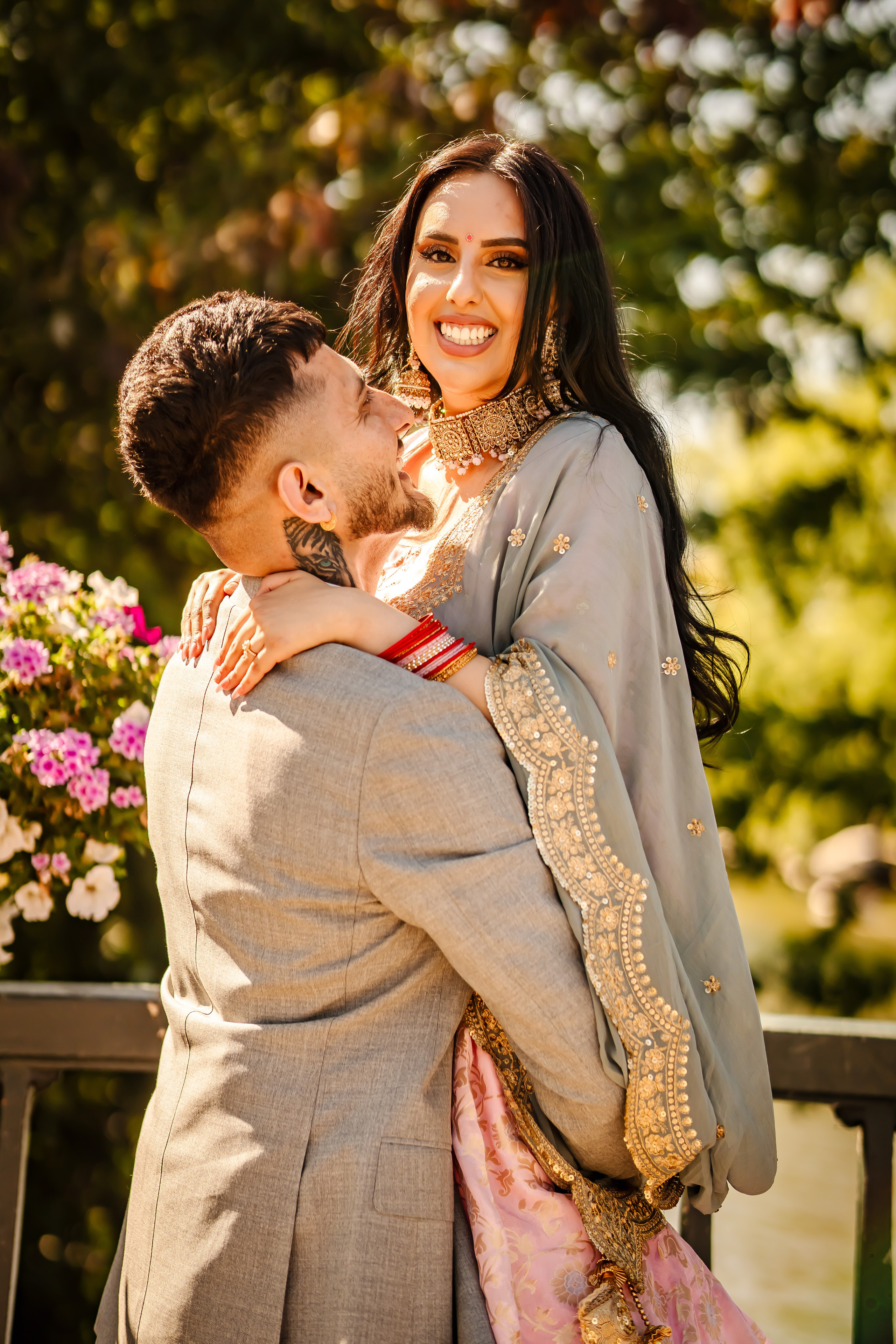 a man liftinmg his wife