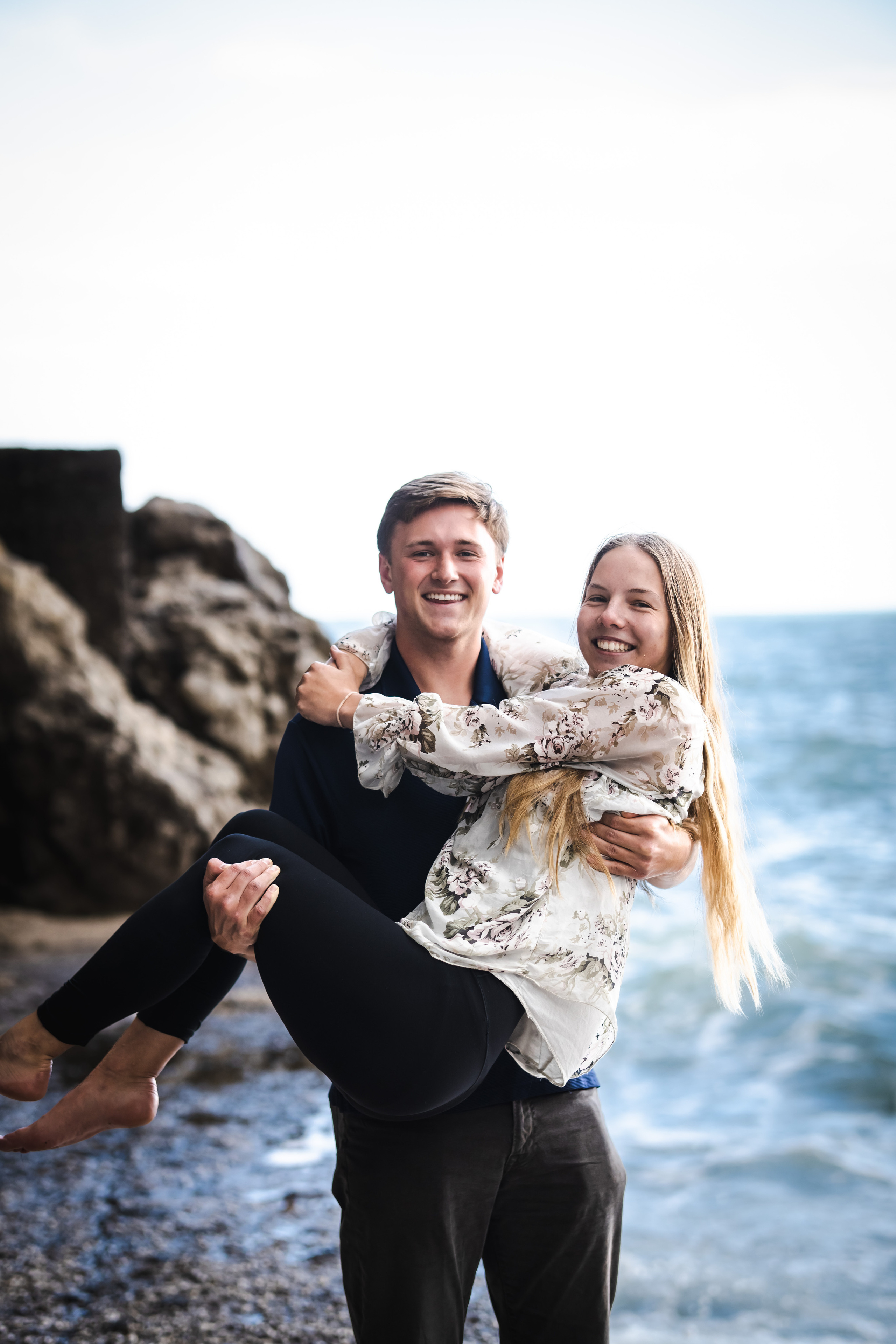 Close-up portrait of man lifting his girlfriend in Amalfi beach