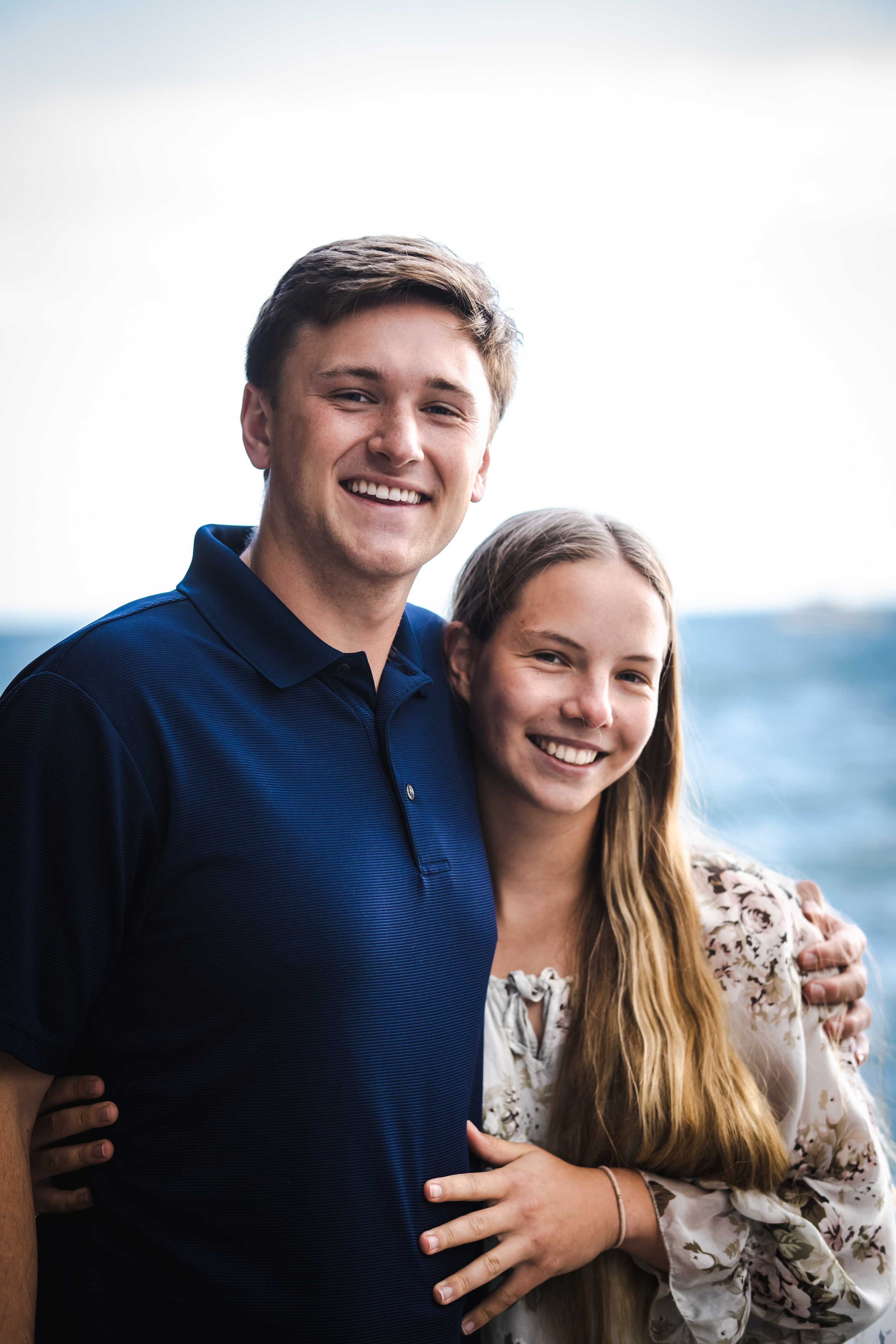 Childhood sweethearts standing in Amalfi beach