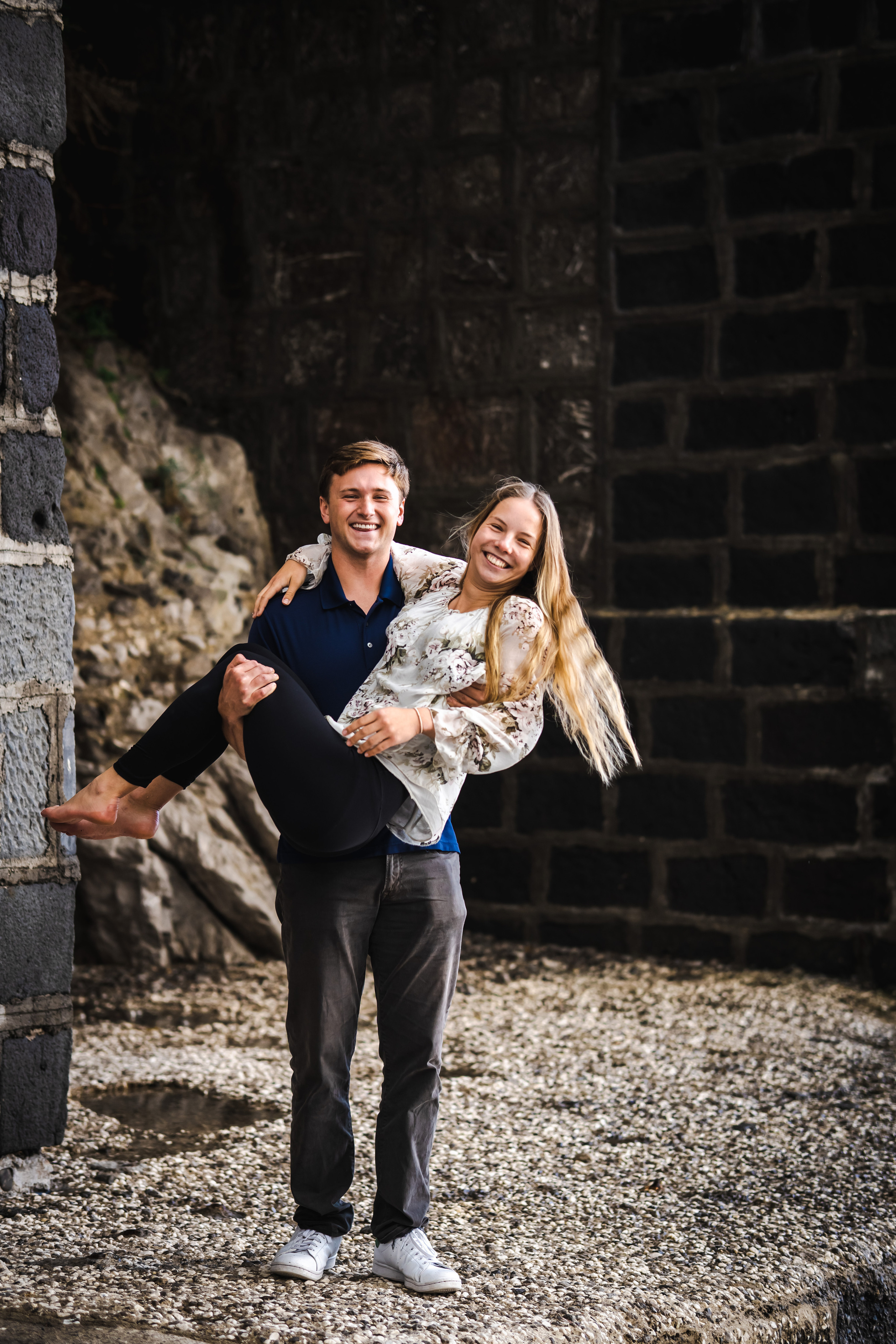 Man lifting his girlfriend in Amalfi beach