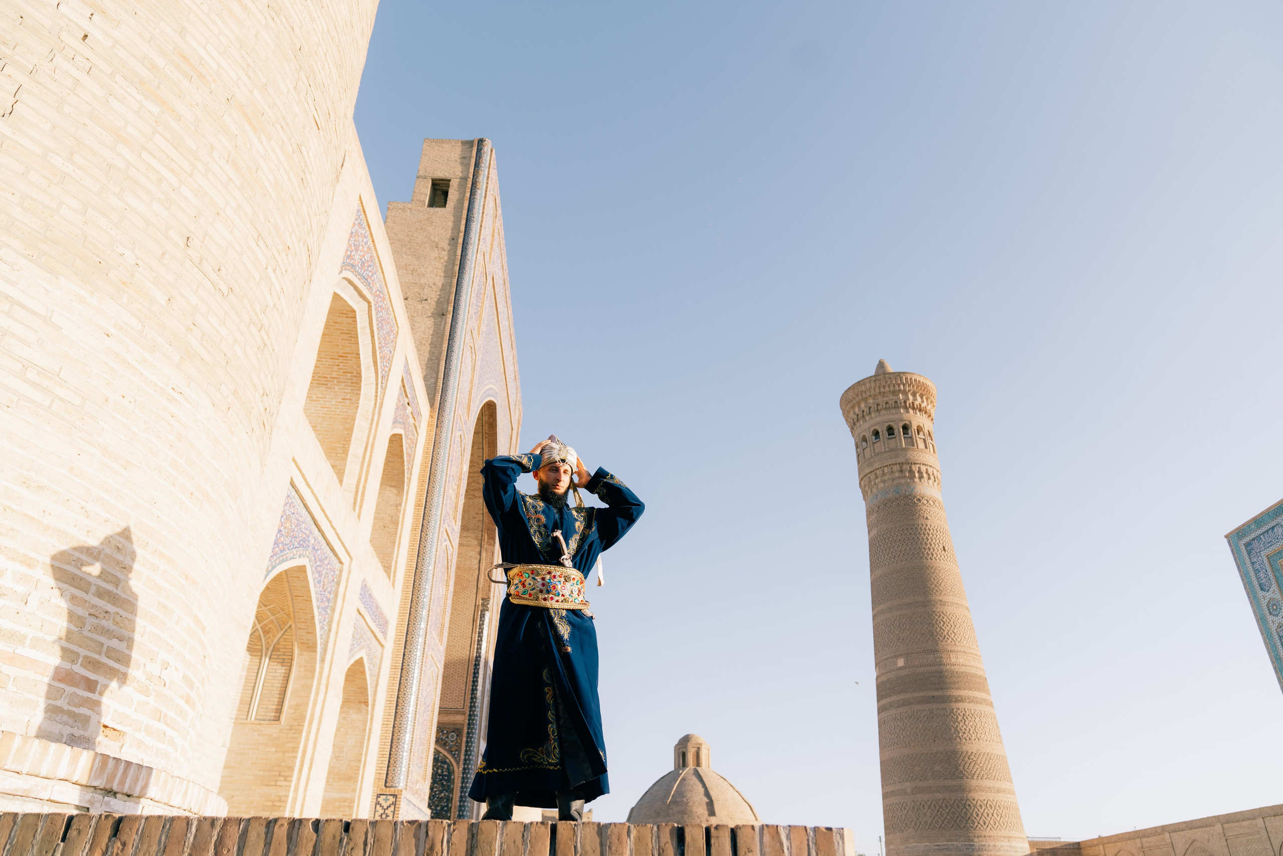 Ethnic men's photoshoot against the monuments of Bukhara