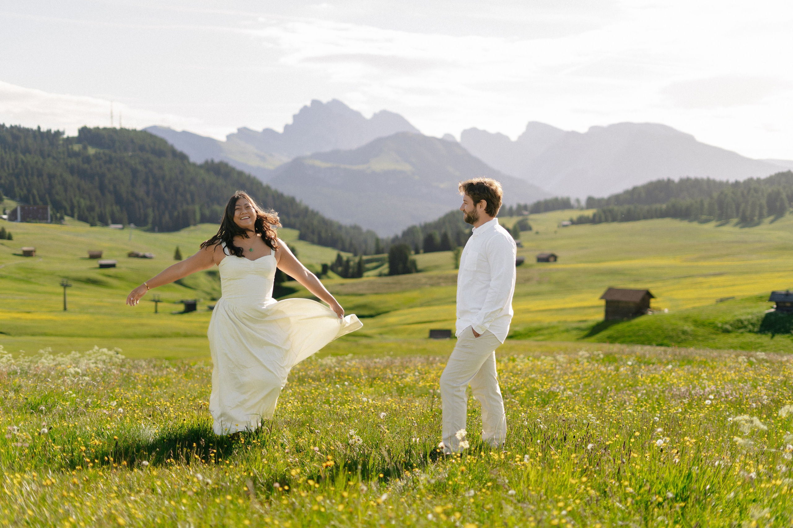 Romantic couple portrait at Alpe di Siusi after a surprise marriage proposal.