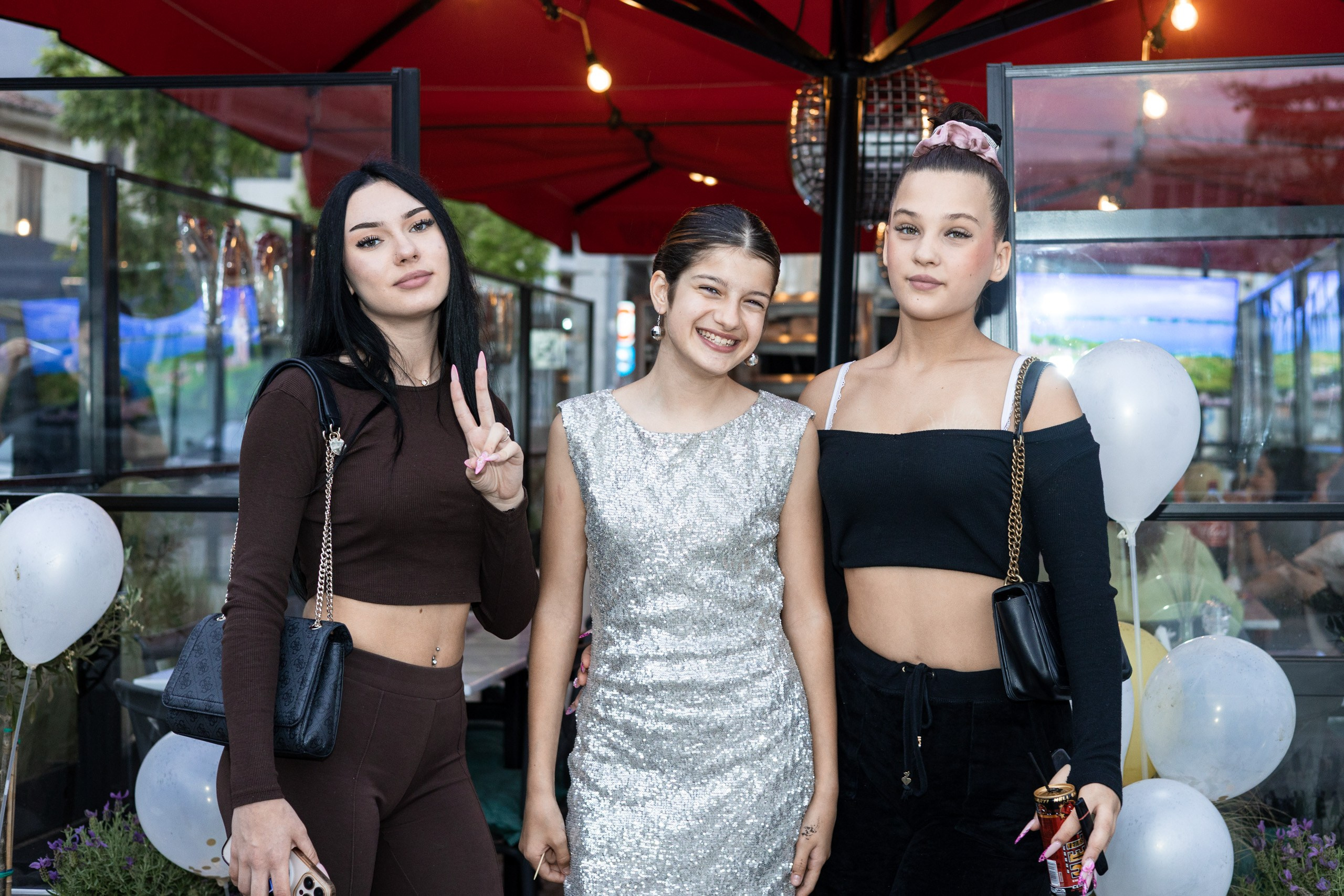 Group of friends posing at a birthday party