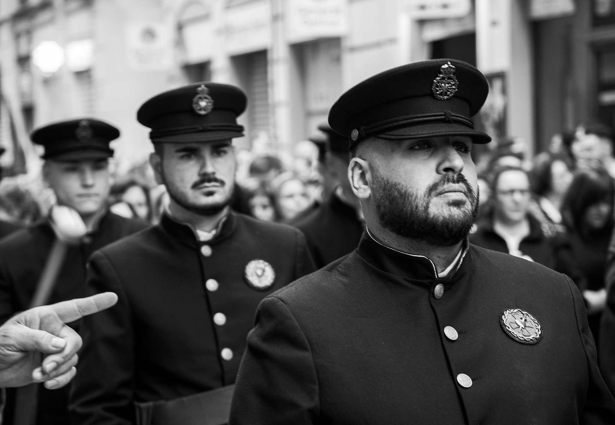 Semana Santa marching band members walking through Malaga, Andalusia, Spain