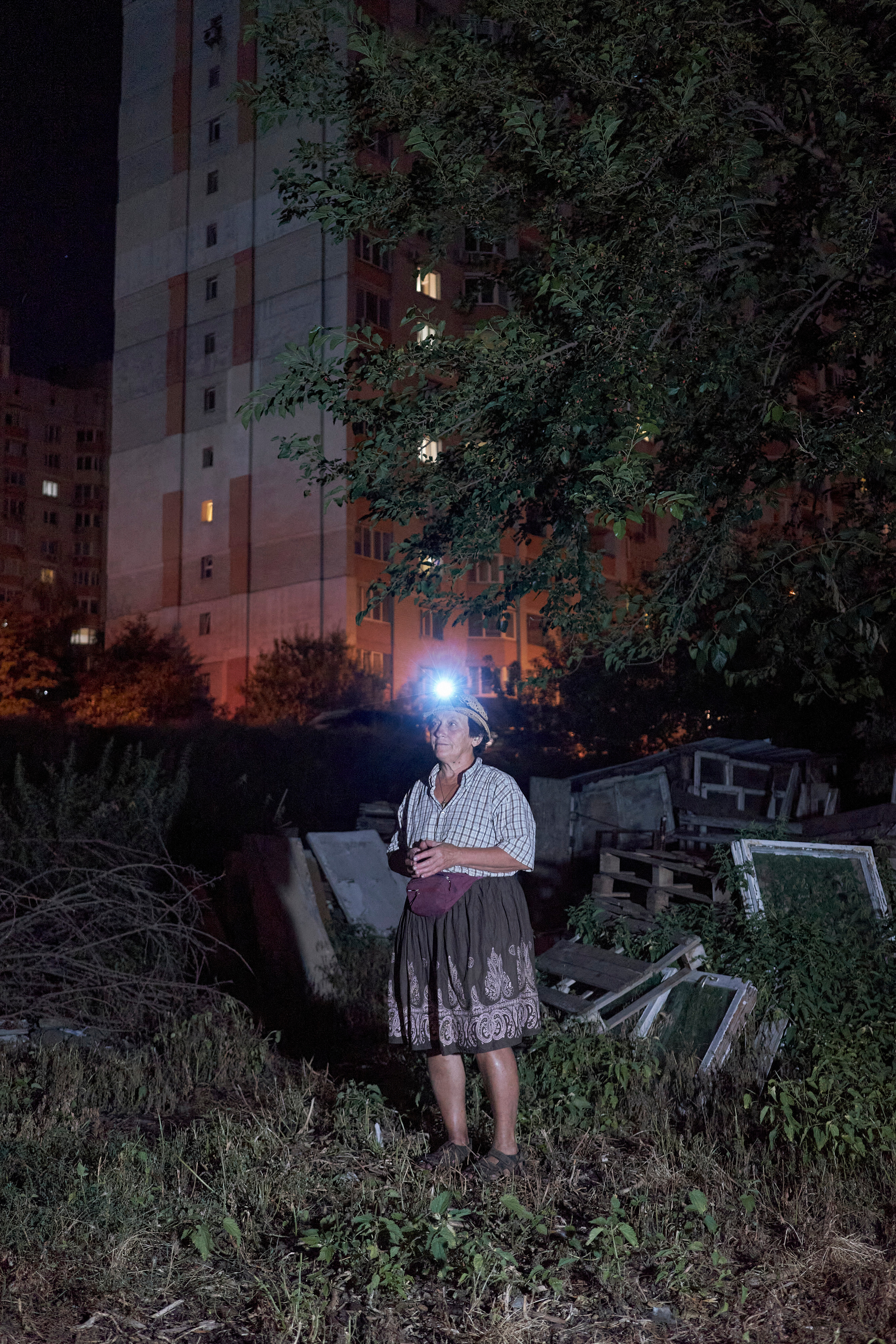 Natalia Dmitrievna in her backyard in the late evening.