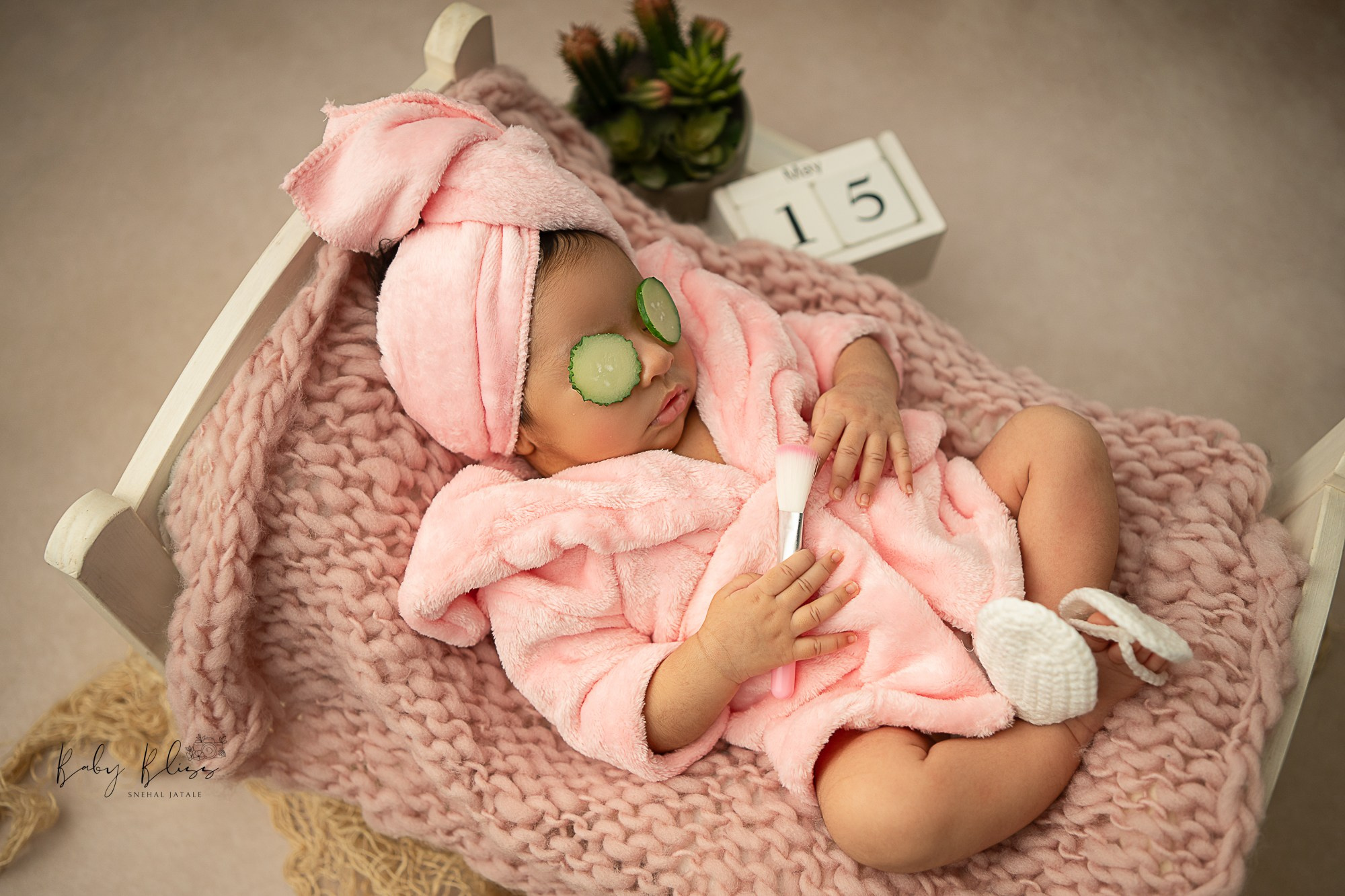 spa themed setup for sleeping baby girl in pink colour