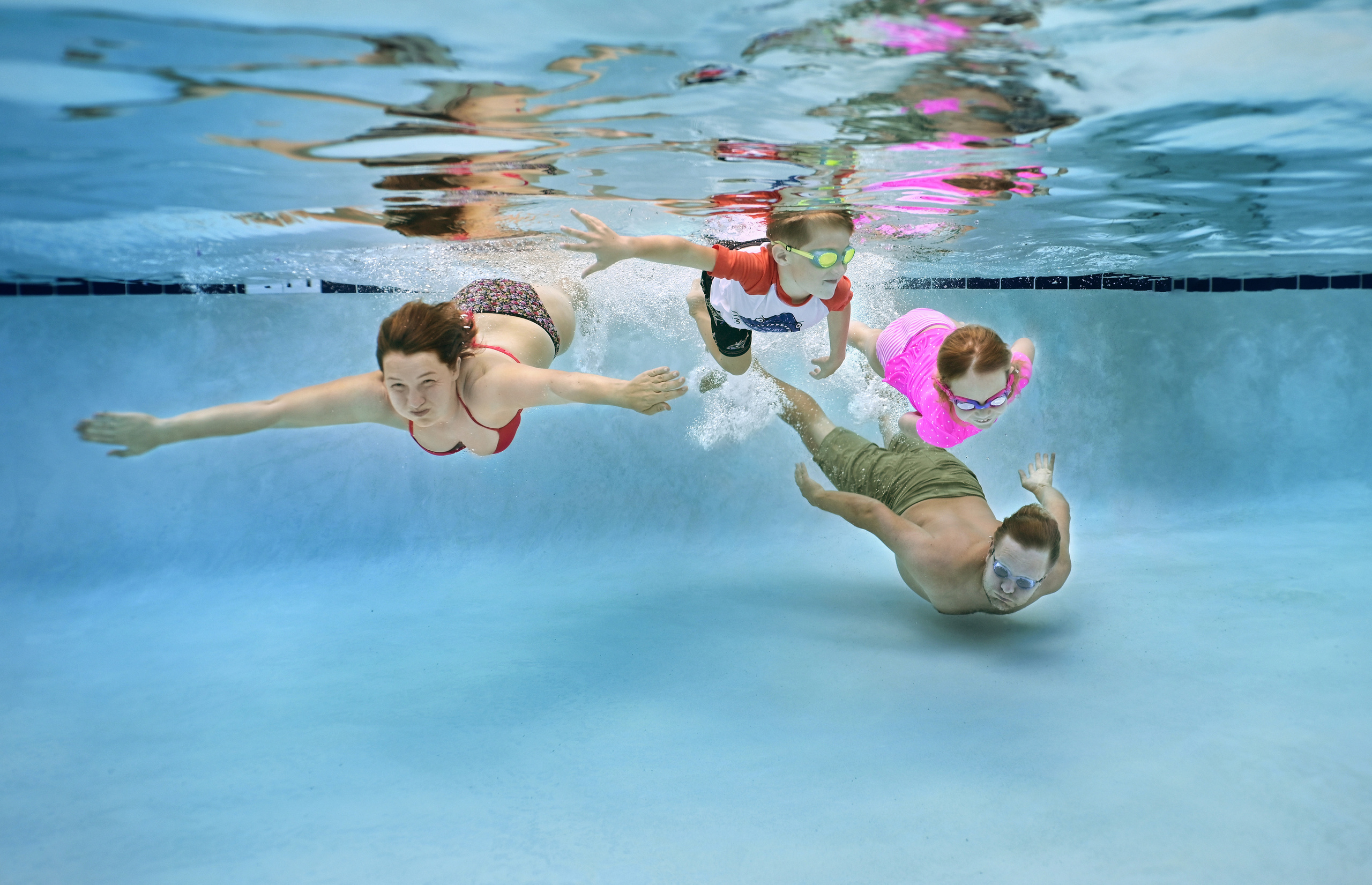 Olga and family underwater session. Family and Sports photographer in Cary Raleigh NC North Carolina