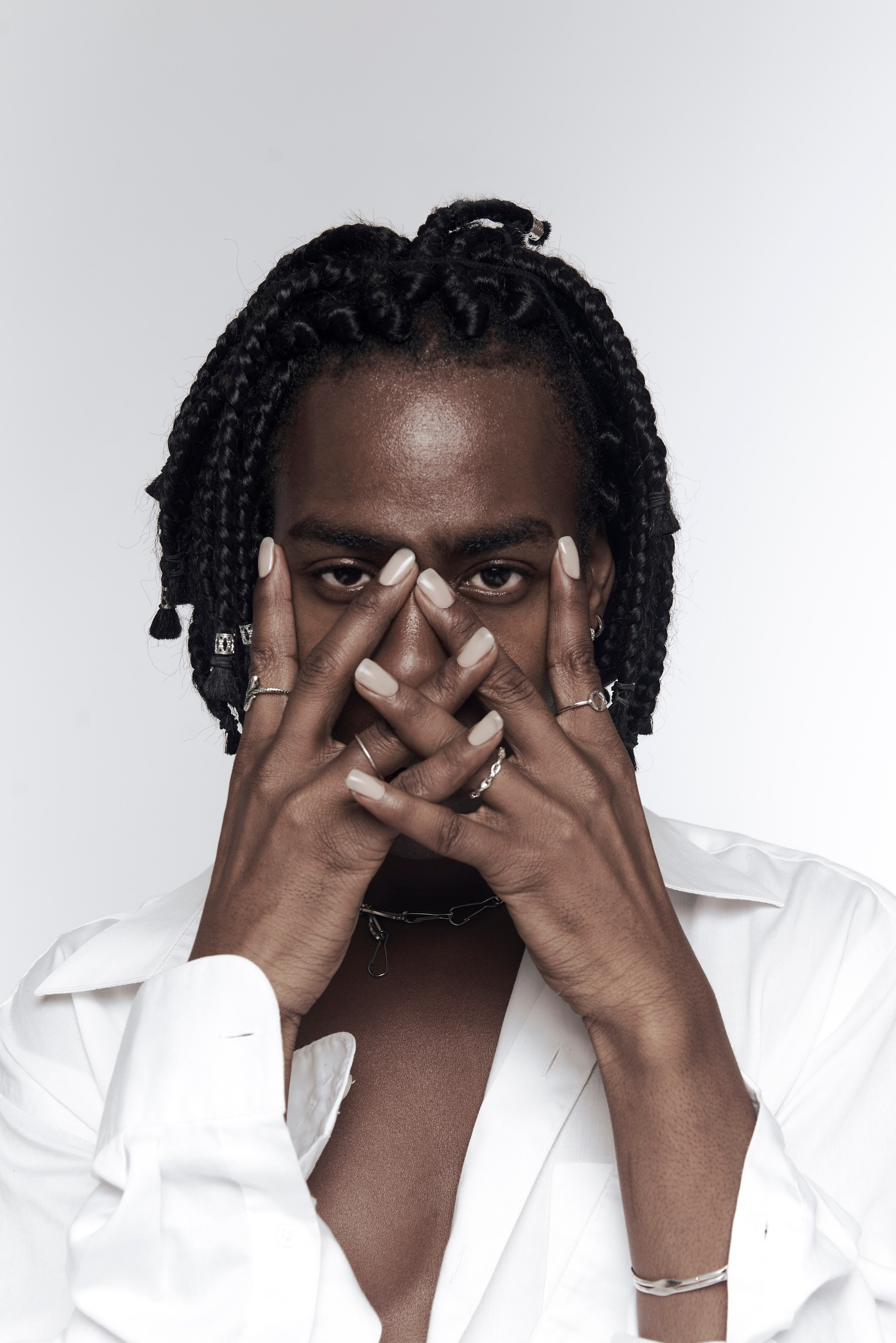 Expressive portrait of a man covering his face with hands