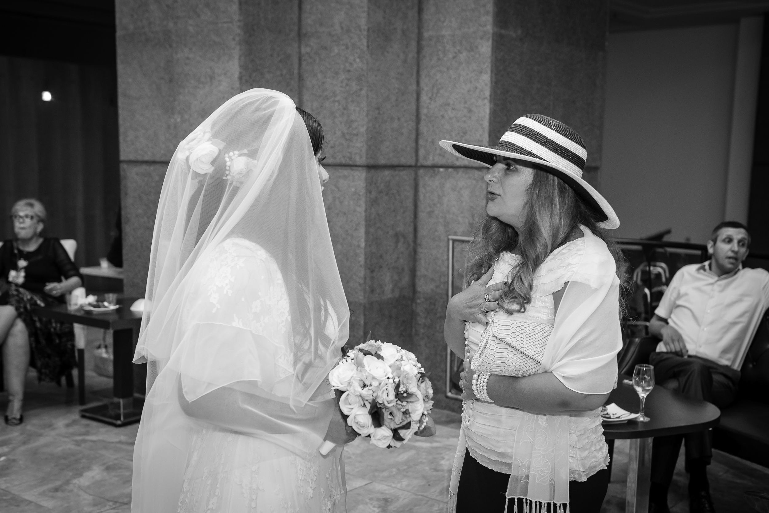 Bride Simone receiving a heartfelt blessing from a guest during the reception at the Leonardo Hotel in Haifa, Israel
