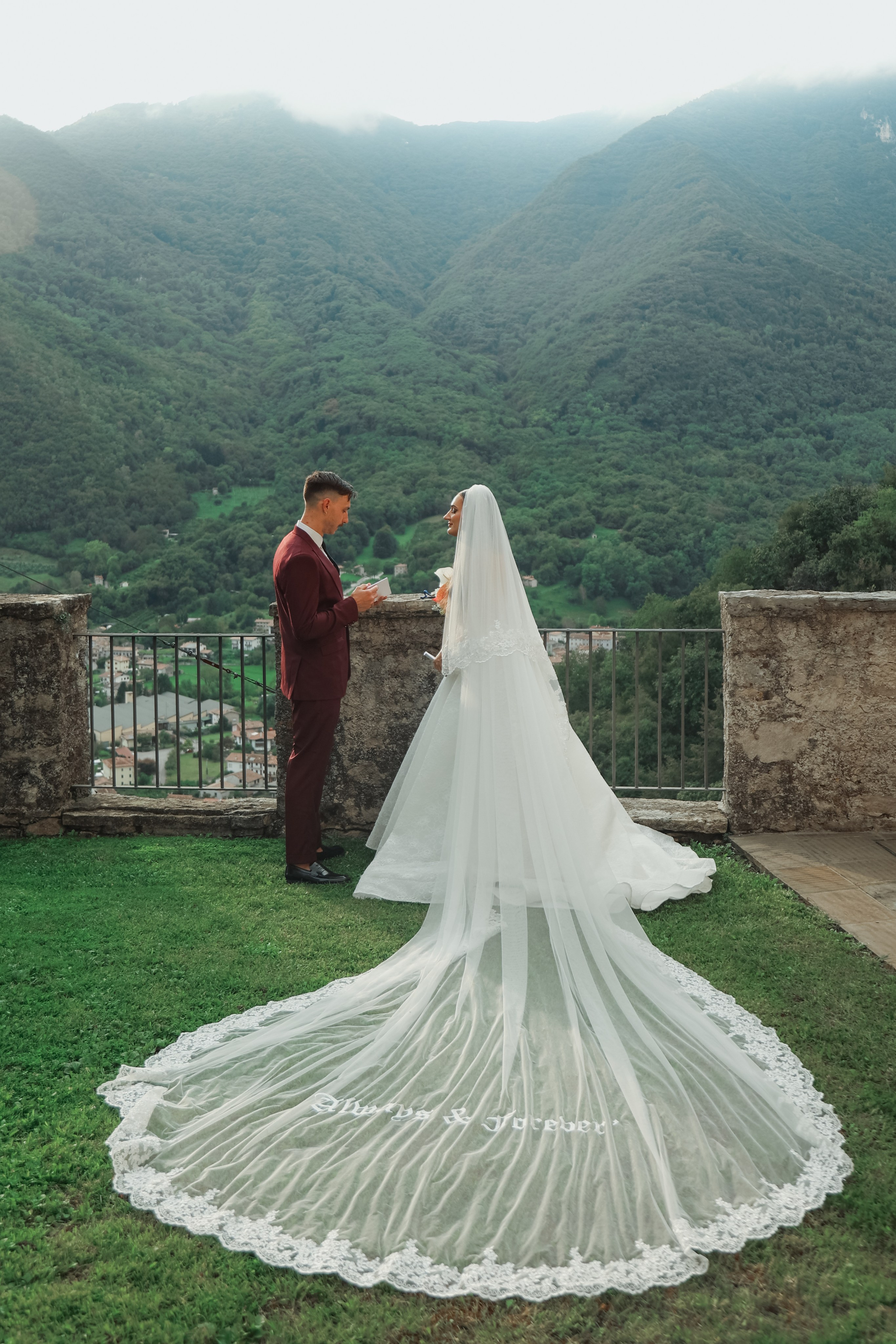 The couple exchanging vows in front of family and friends