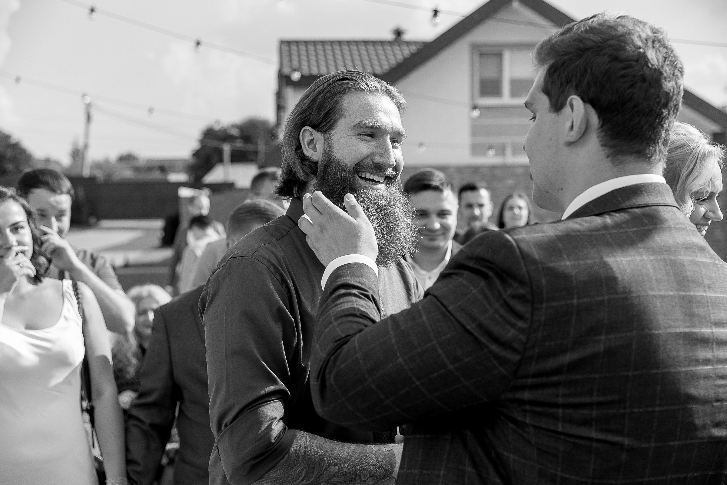 Guests smiling during ceremony, by Bude, Cornwall wedding photographer.
