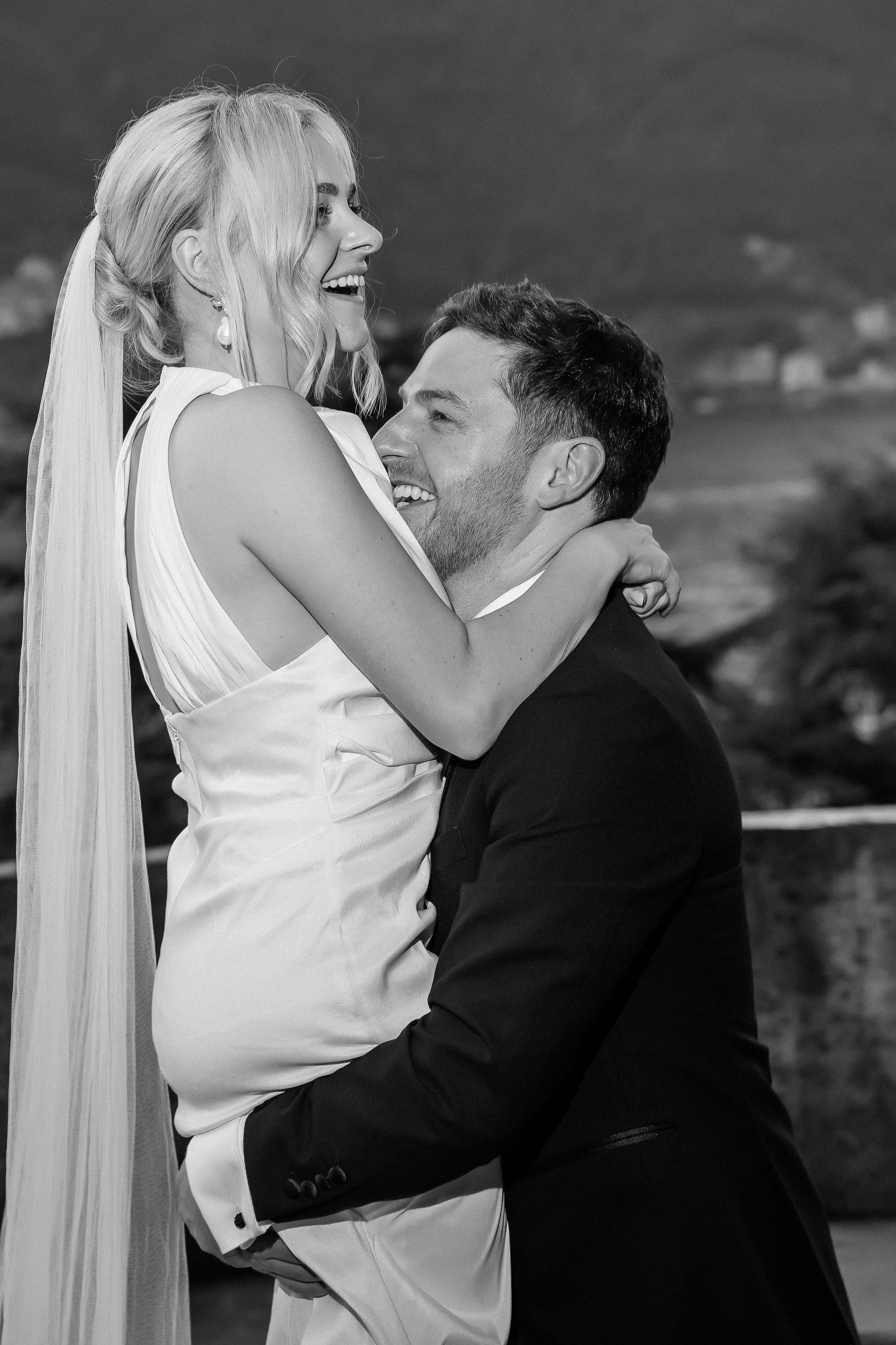 Black and white romantic photo of the bride and groom at Villa Lario, Lake Como, Italy