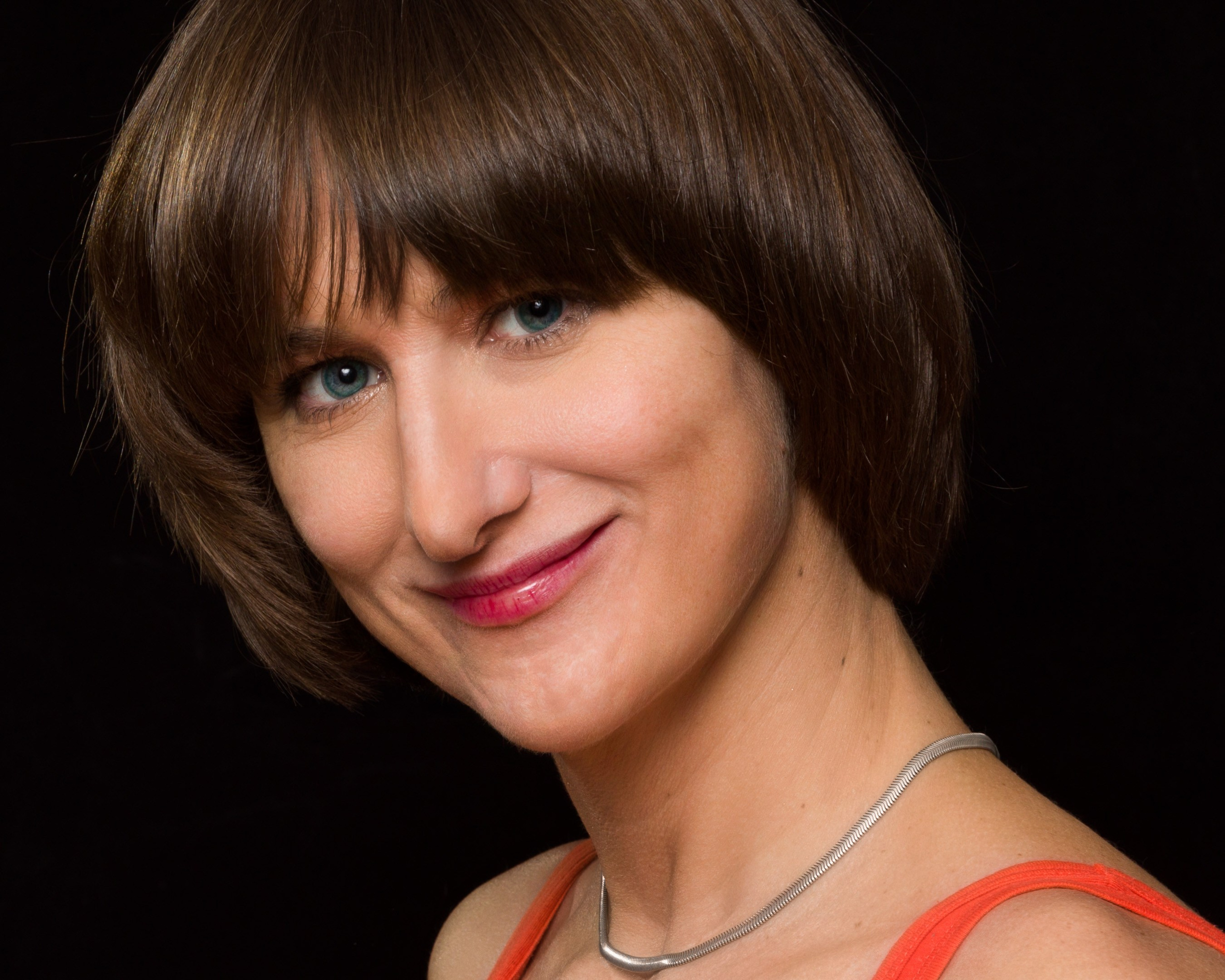 Portrait of a young lady on blalck studio background - photographer Andrey Dunin