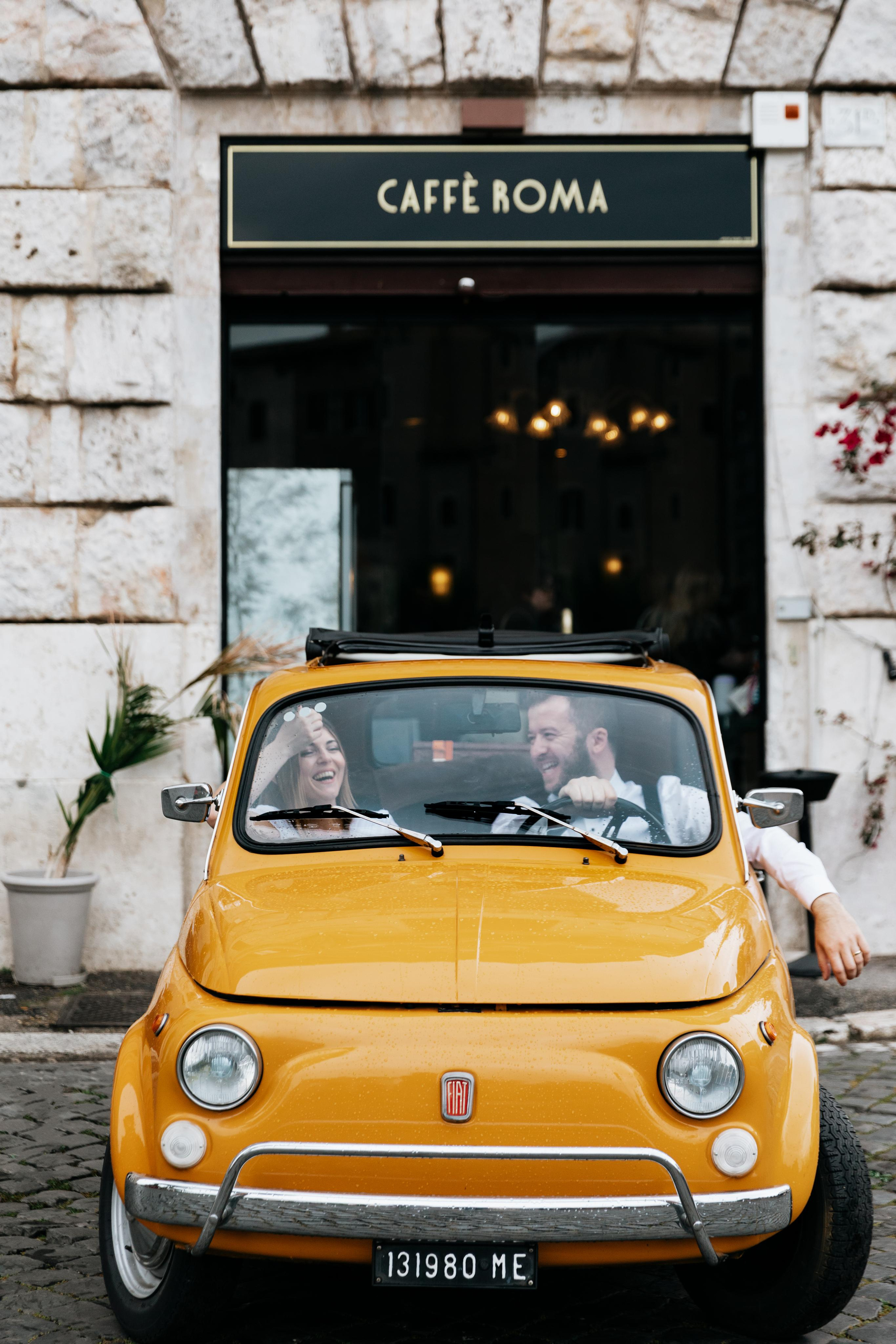 Fiat 500 and Vespa. Photographer in Rome