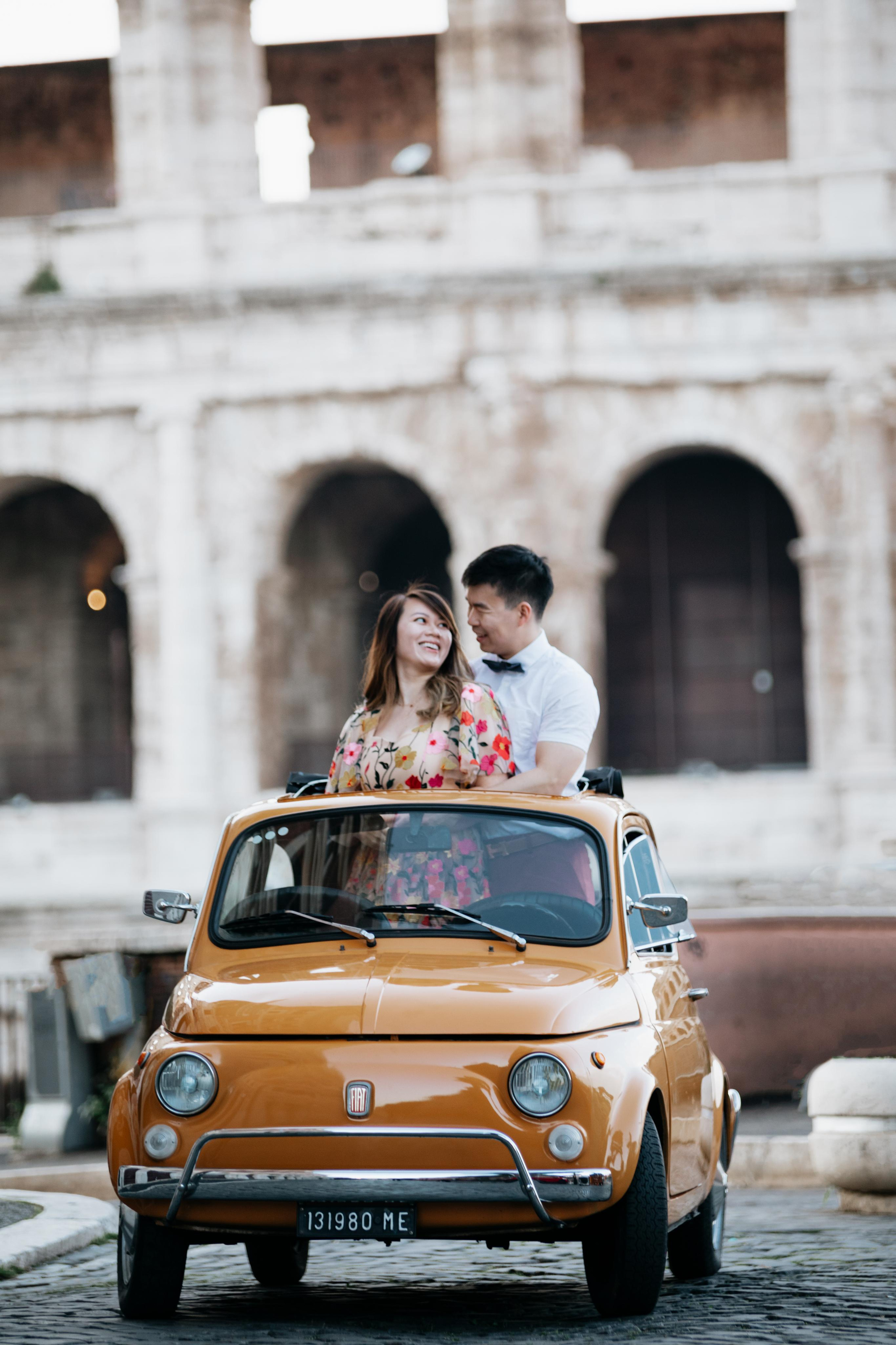 Fiat 500 and Vespa. Photographer in Rome