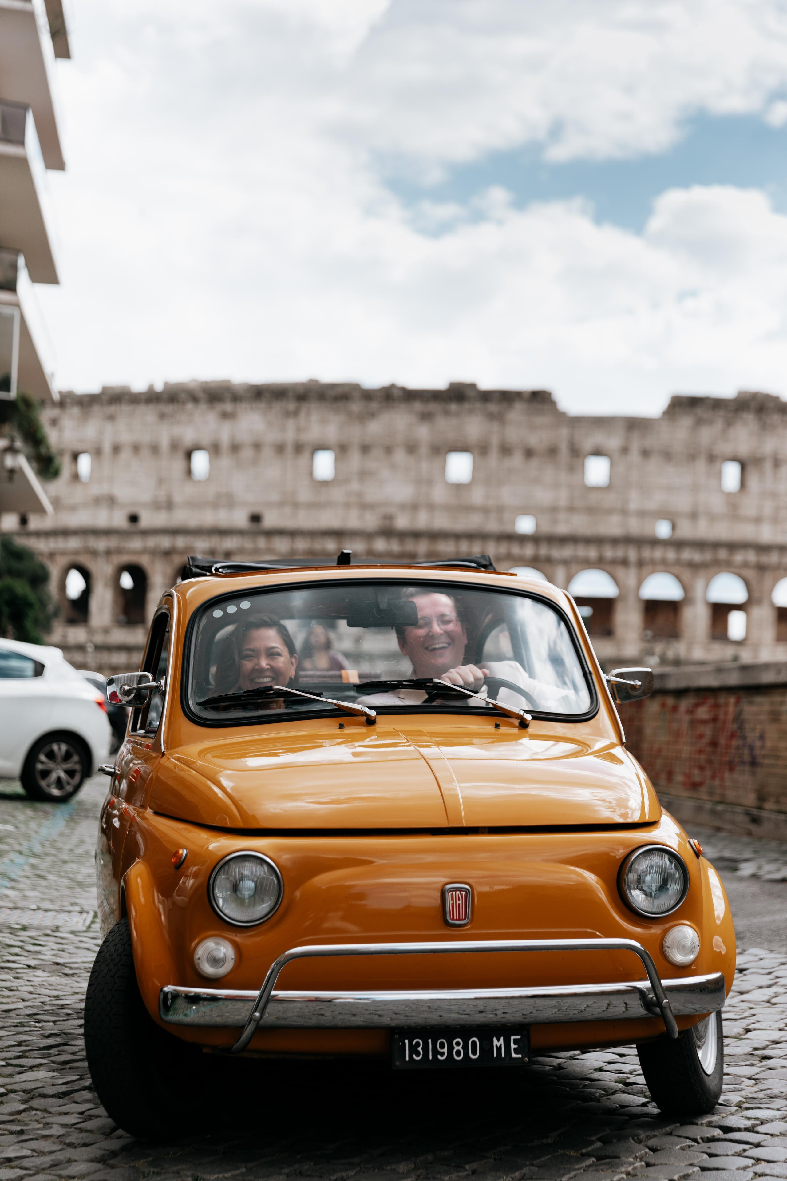 Fiat 500 and Vespa. Photographer in Rome