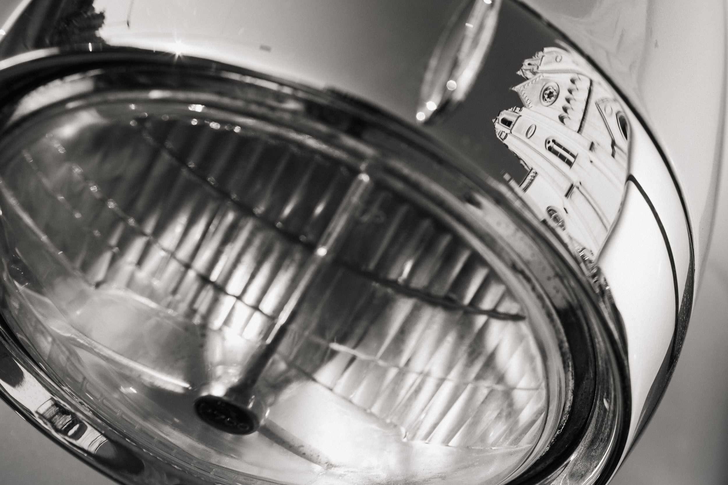 Church is mirrored in the car's chrome part