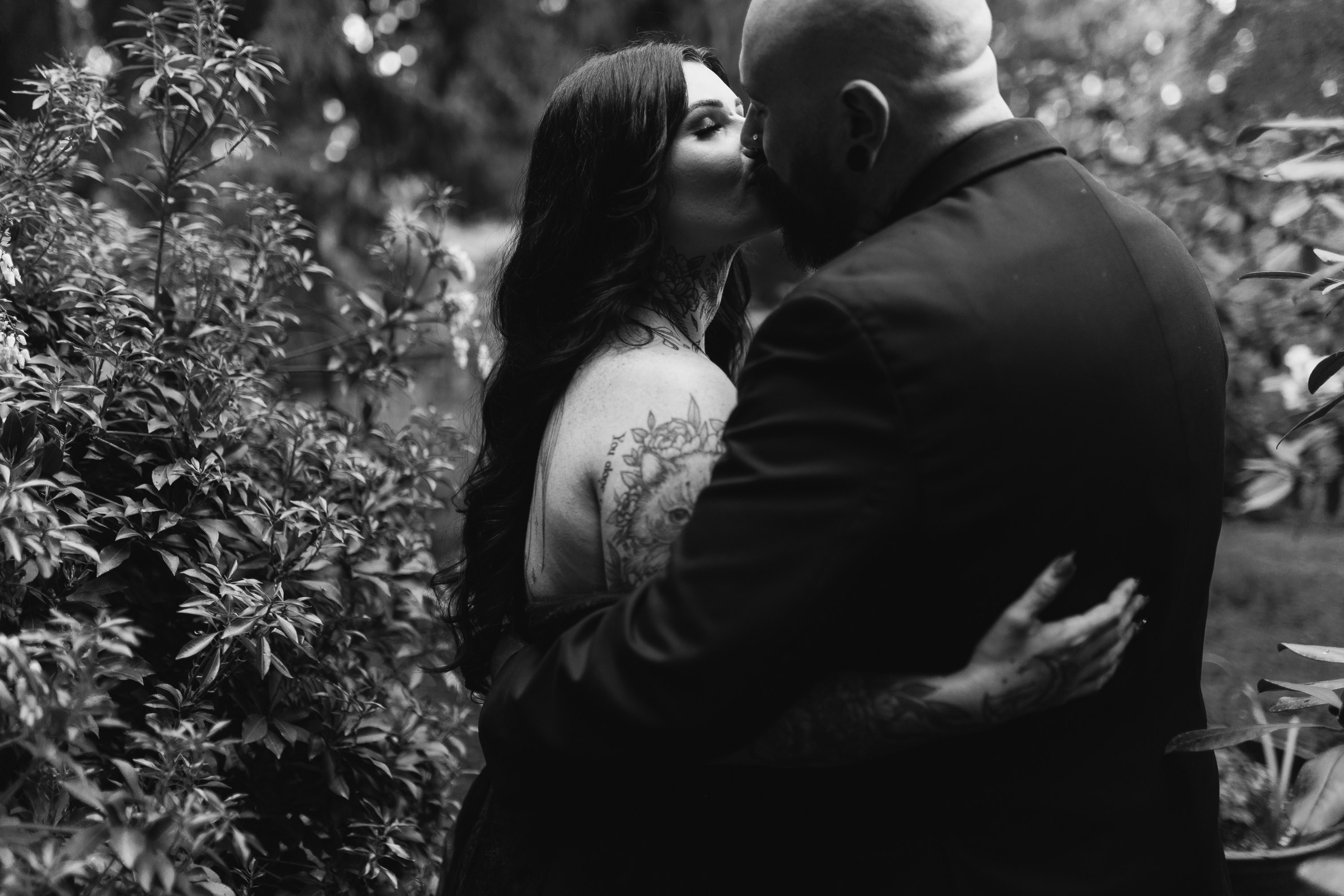 Bride and groom hugging, black and white emotional moment