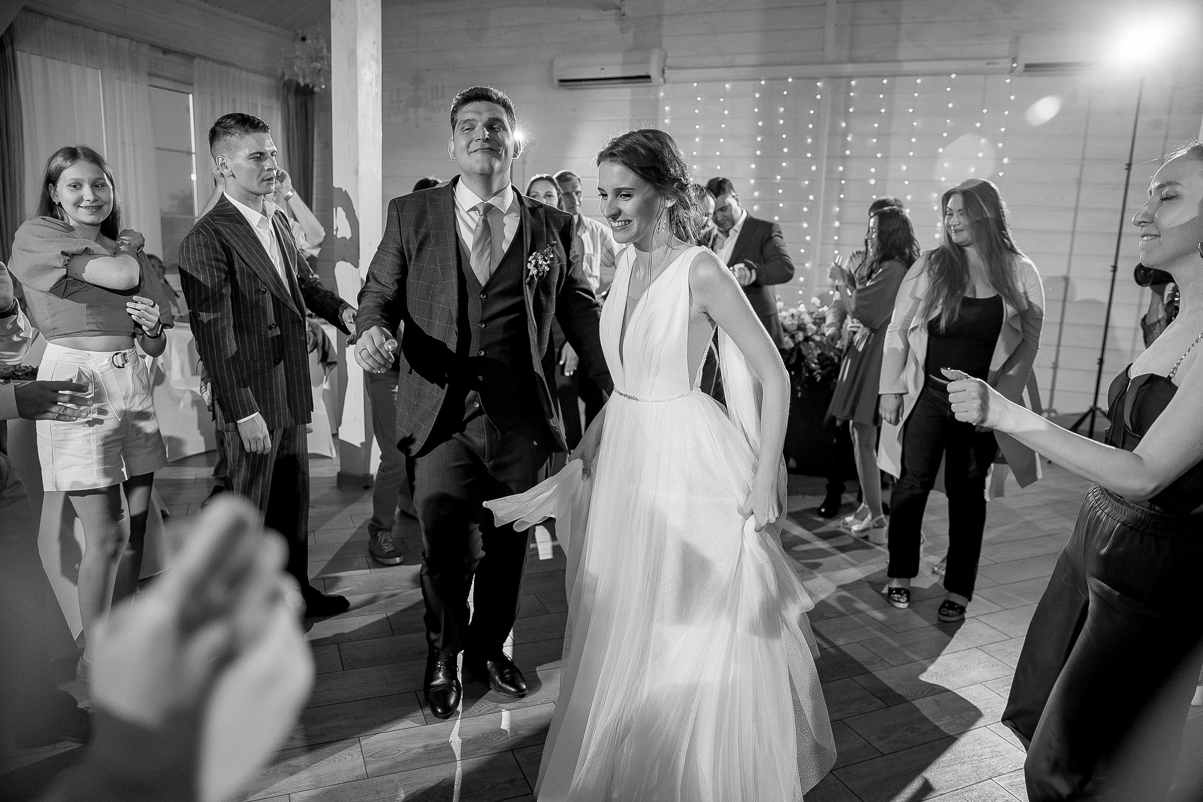 Bride and groom dancing, by Bude, Cornwall wedding photographer.