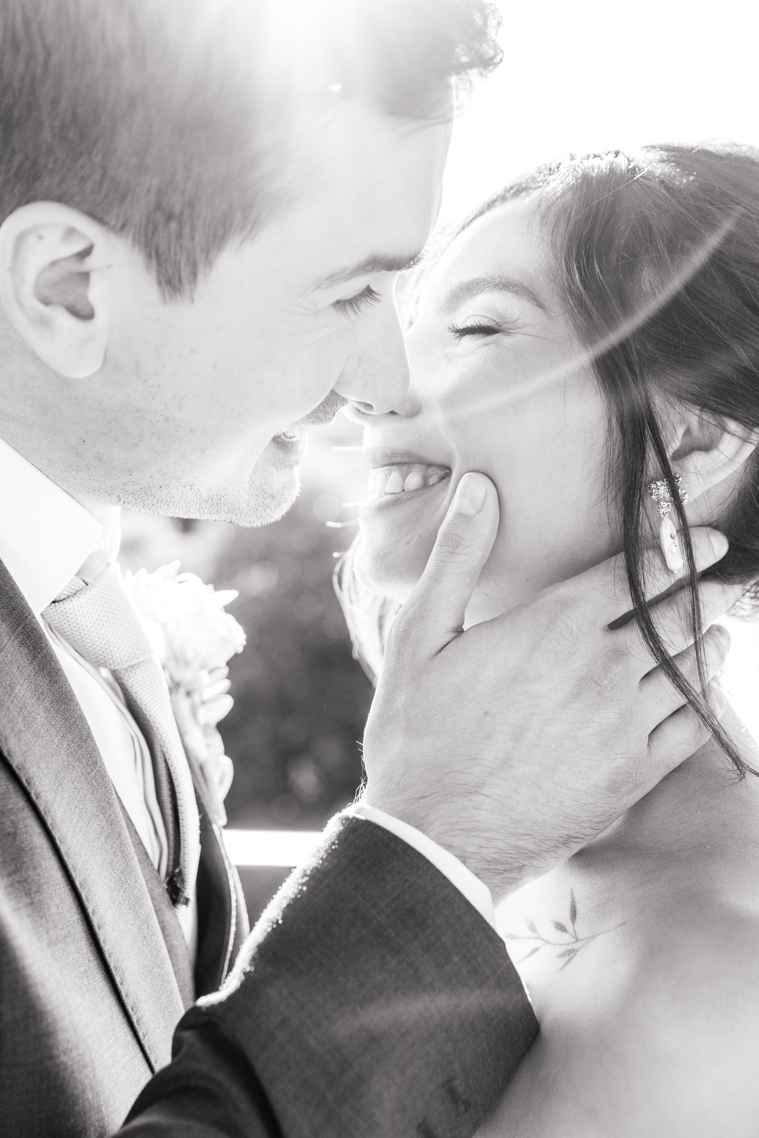 Bride and groom sharing a romantic look during their wedding portrait session in Barcelona, capturing pure happiness.