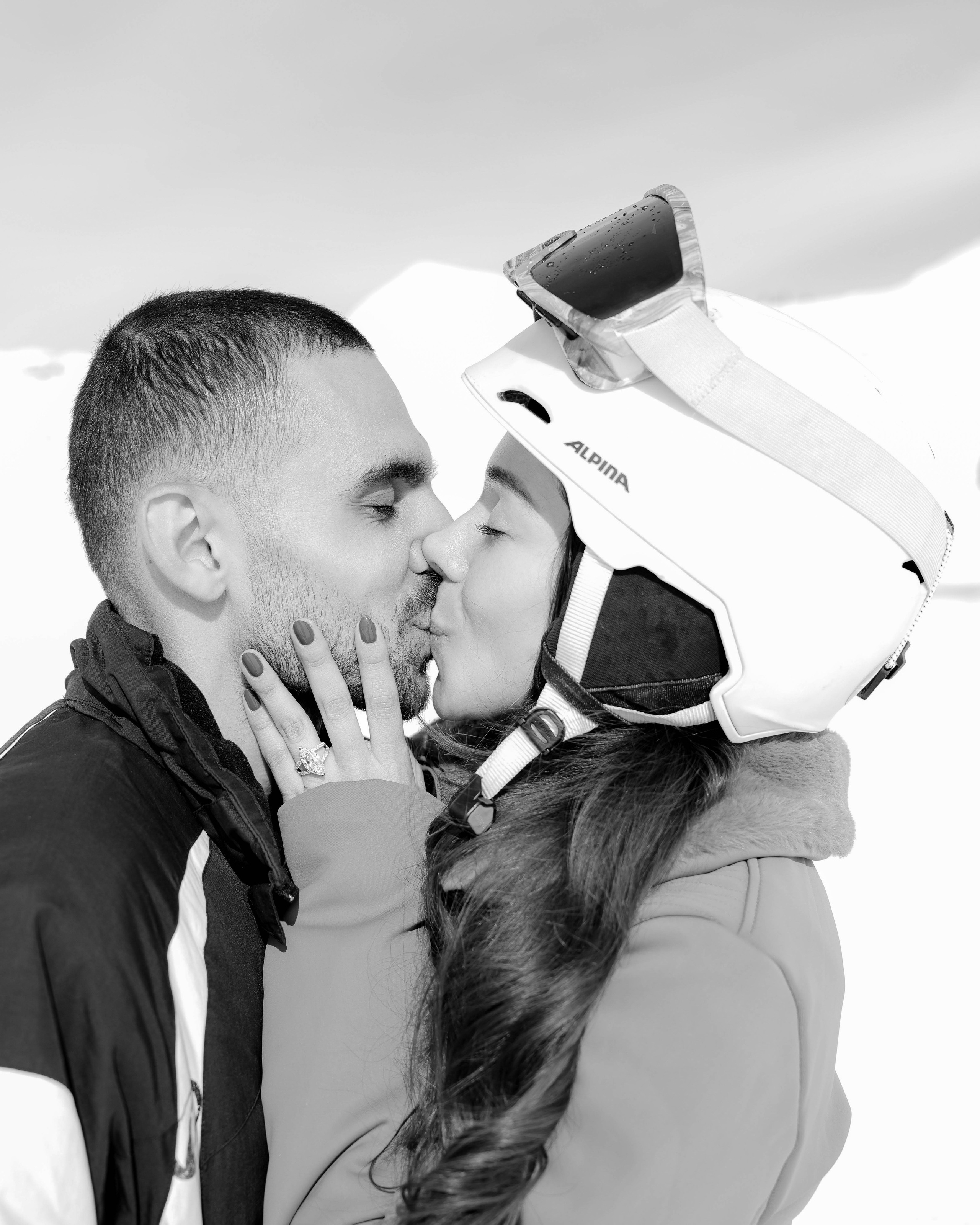 Couple kissing in winter mountain atmosphere