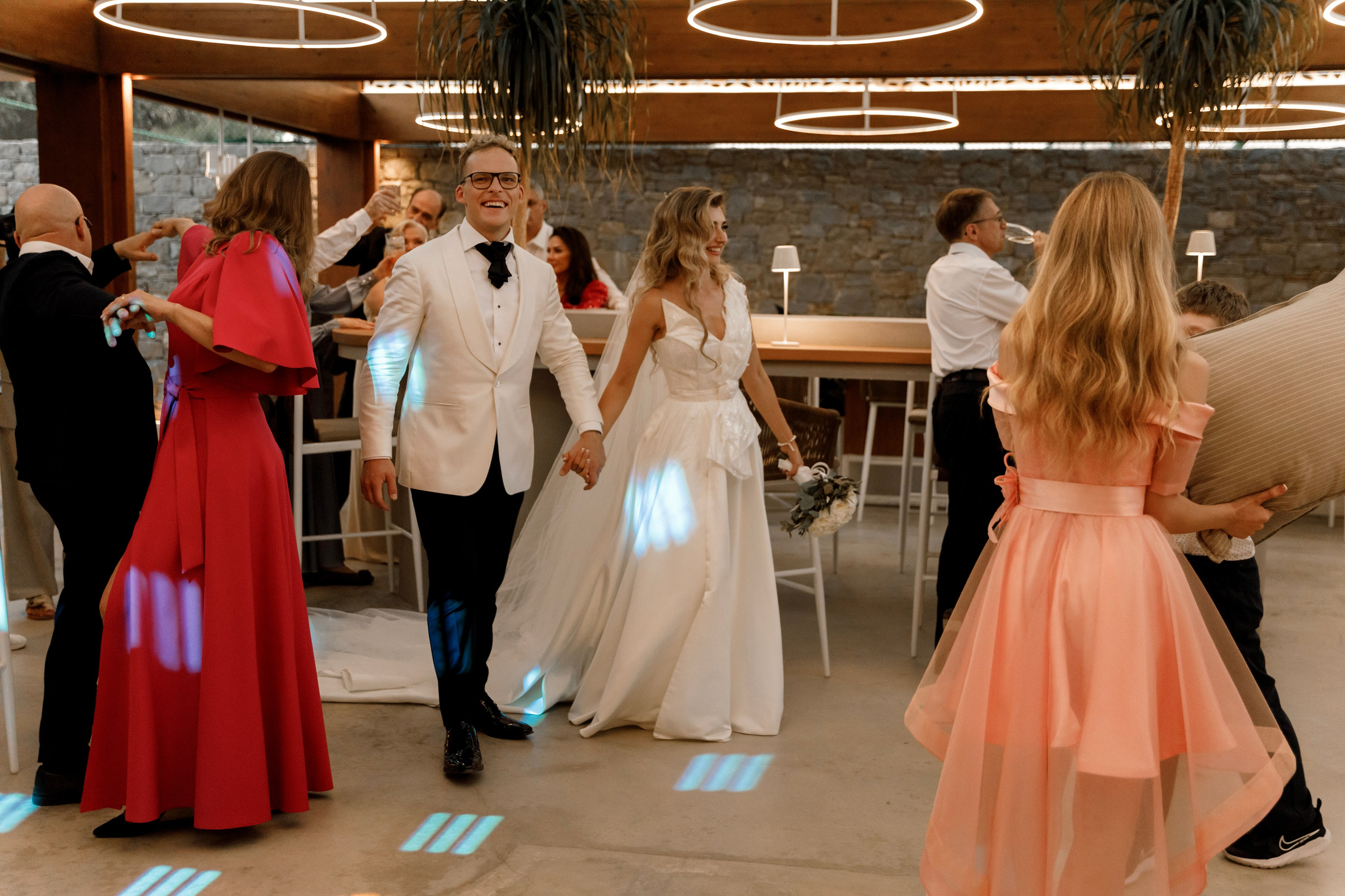 Bride and groom are coming inside the restaurant and see the Wedding guest contests in Lithuanian wedding. Rhodes Greece