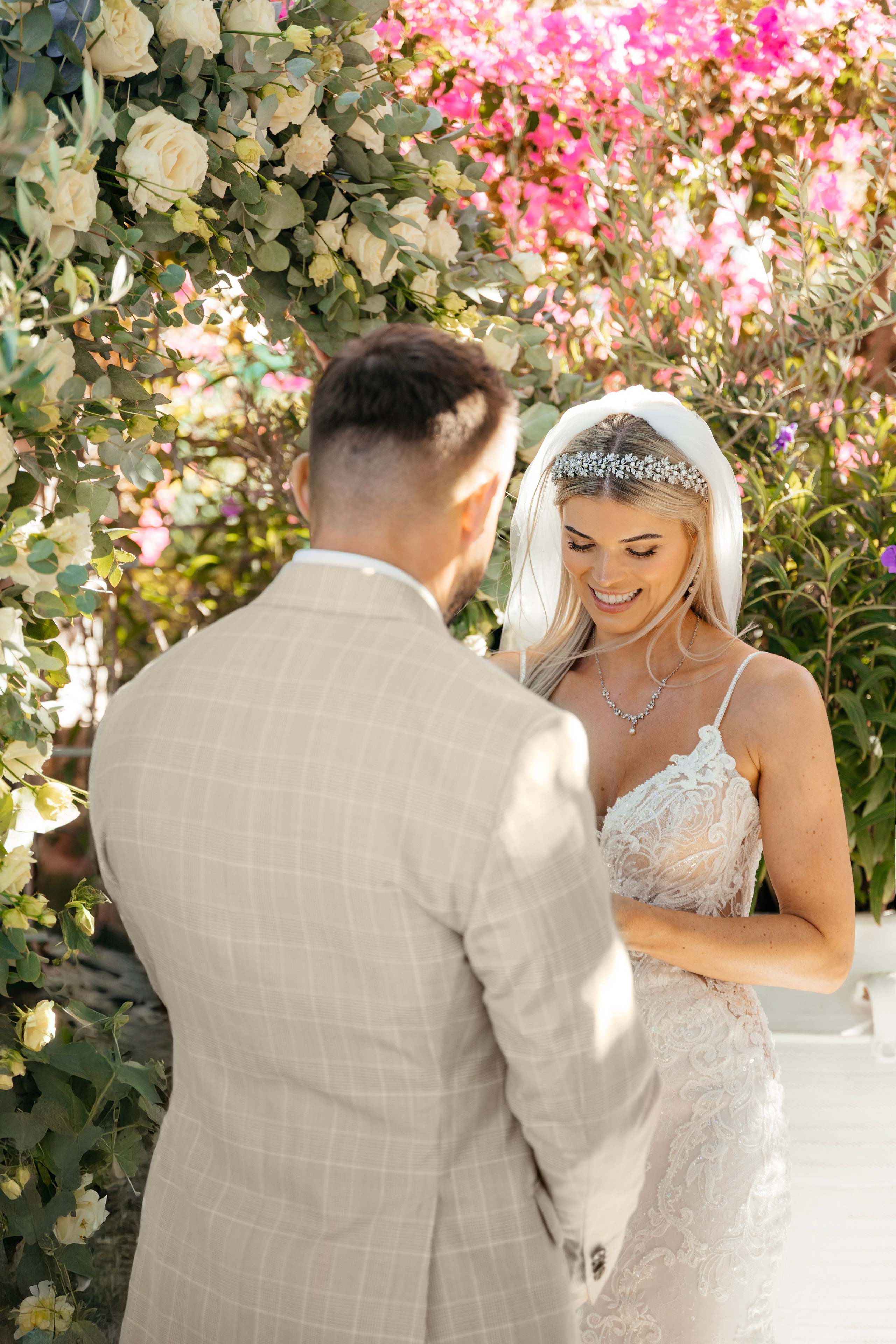 Romantic wedding ceremony in Lindos, Greece, with the couple holding hands, Wedding photographer, Rhodes