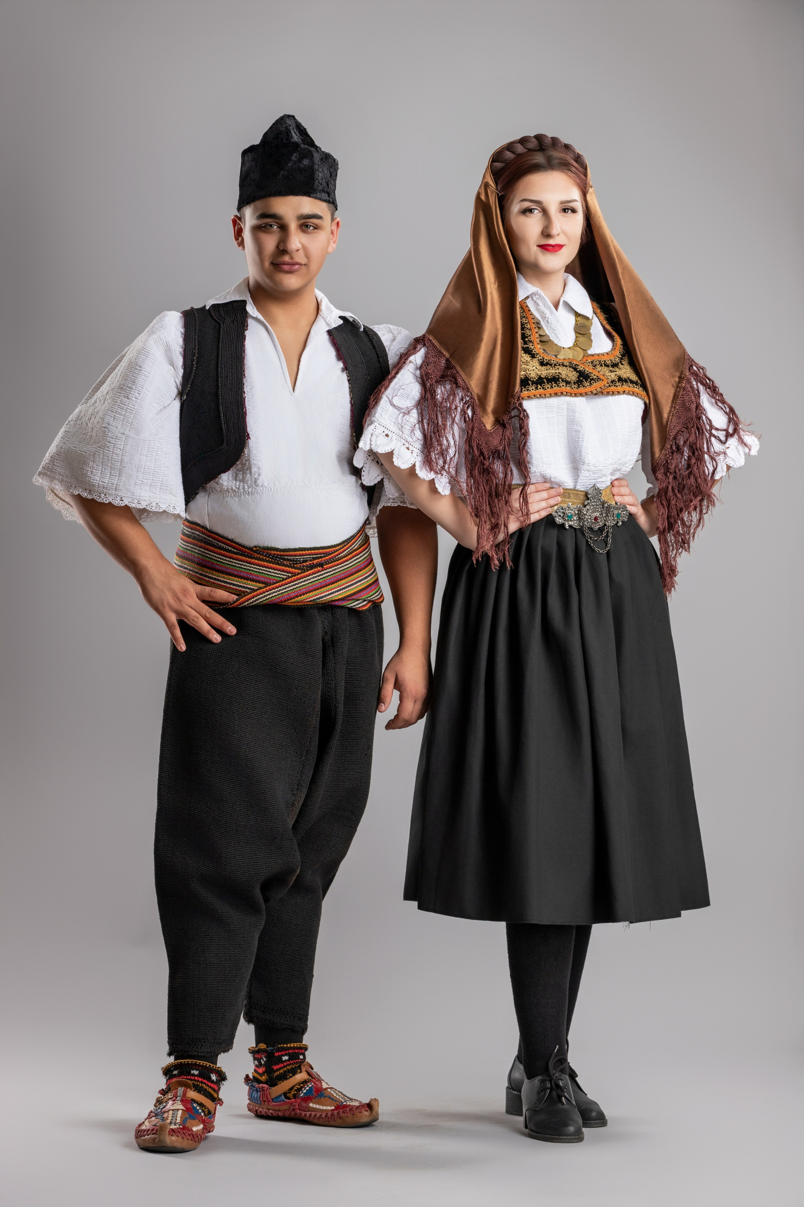Studio portrait photography of traditional folk costumes from Bosnia and Herzegovina featuring authentic cultural clothing, embroidery, jewelry and handcrafted garments, photographed by Namir Čomaga. The images highlight the richness, craftsmanship and cultural heritage of Bosnian traditional costumes through carefully lit studio portraits.