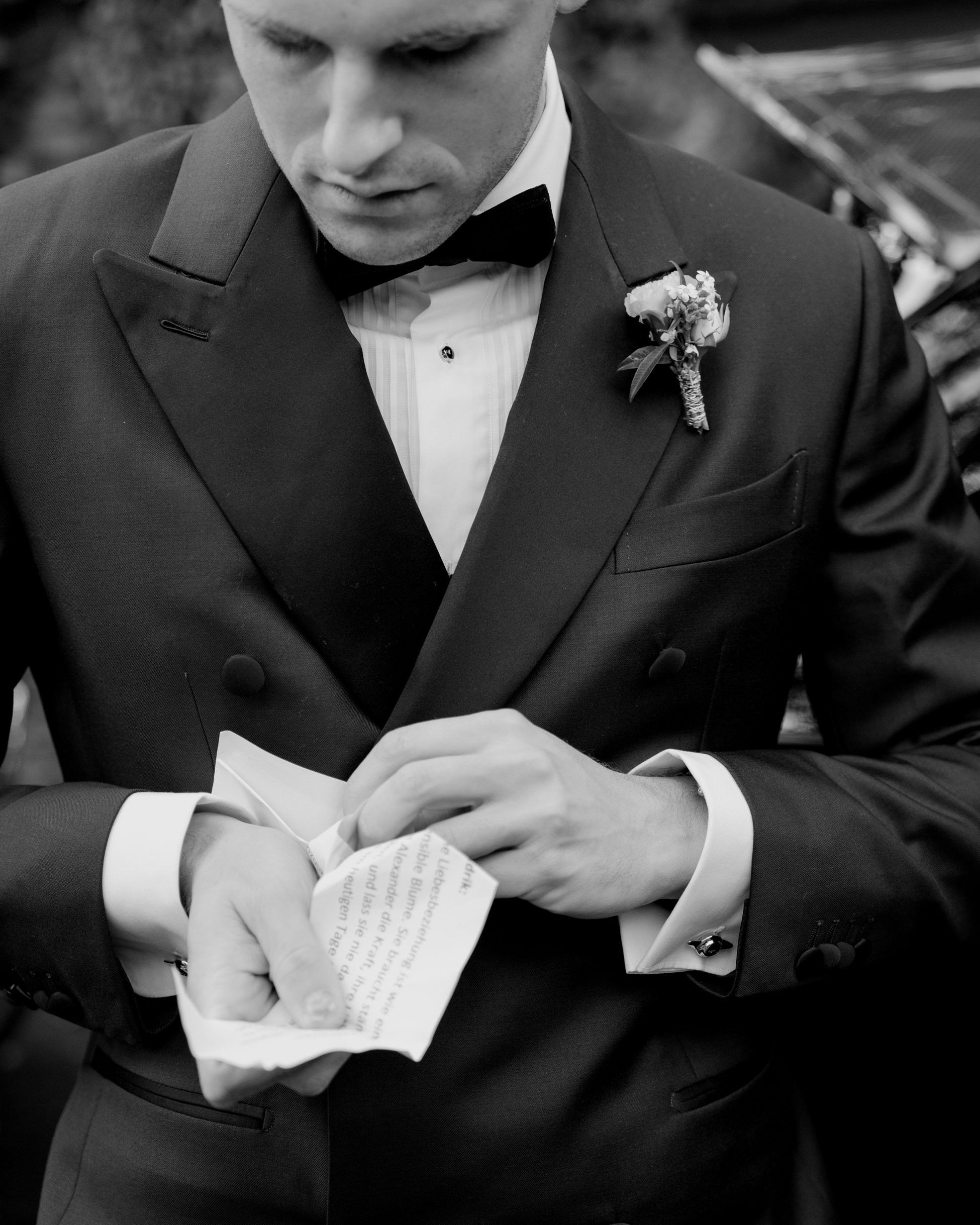 Brother of the bride reading wedding vows, black tuxedo with boutonnière, luxury wedding Frankfurt Villa Rothschild