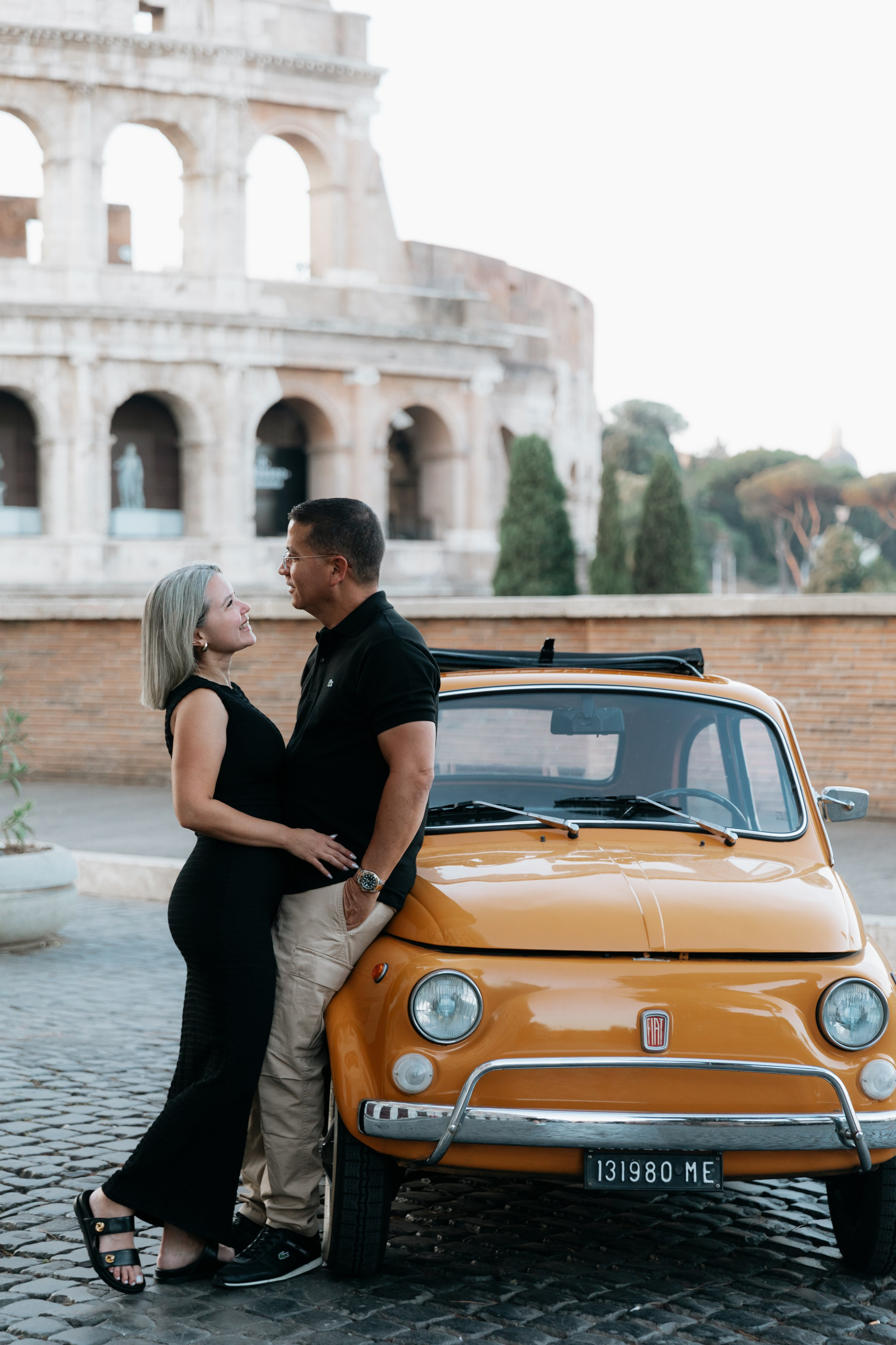 Fiat 500 and Vespa. Photographer in Rome